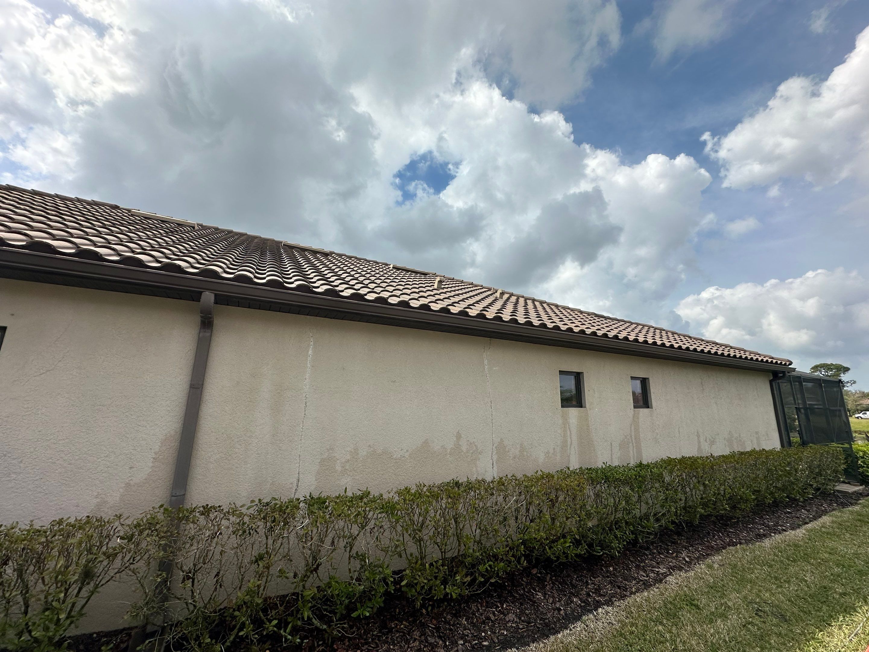 Concrete Tile Roof, Paver Pool Deck, Screen Enclosure & Driveway Cleaning in Artisan Lakes Esplanade, Palmetto, FL | Sunshine AquaWash by Sunshine AquaWash