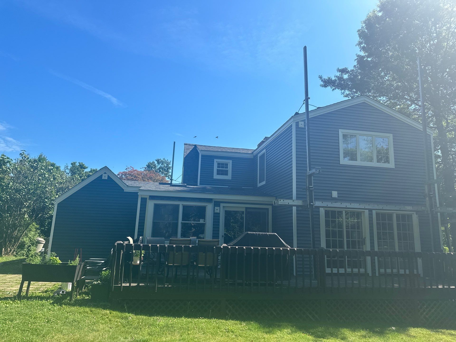 Complete Exterior Estate gray with Pacific Blue Siding by A Plus Exterior