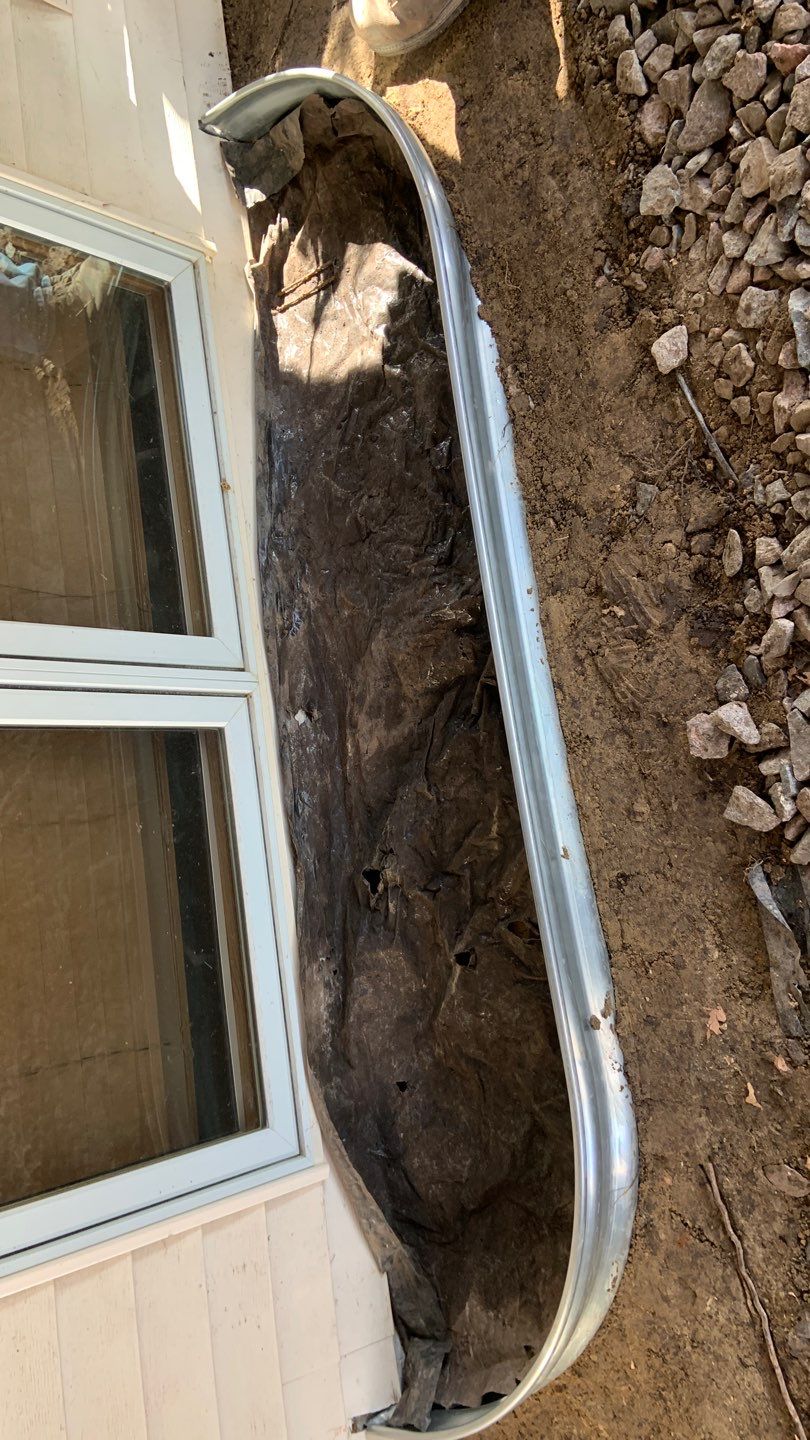 Basement Window Well & Drainage Board in Maple Grove, MN by Waterproofing Northeast