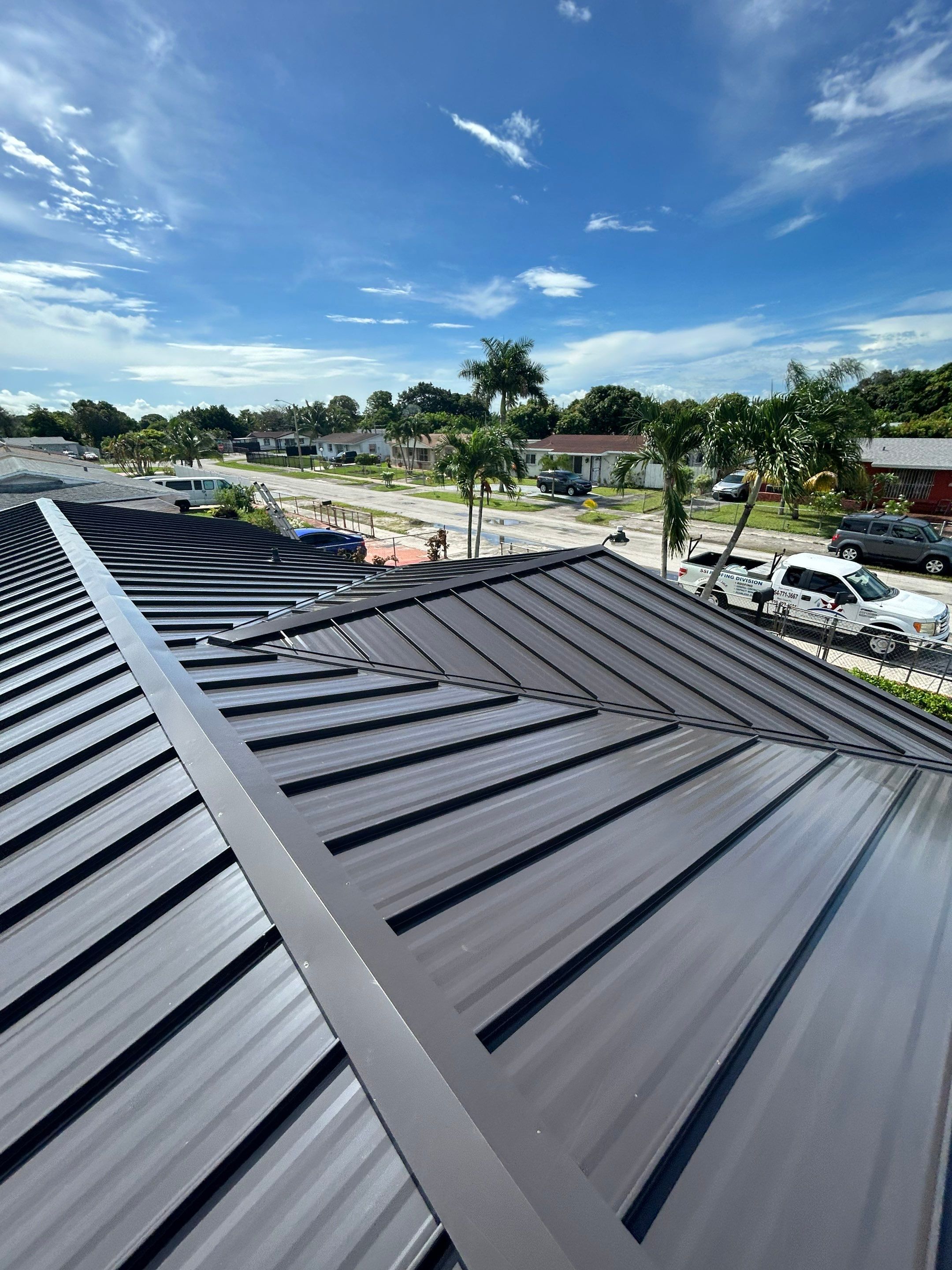 Shingle to Metal with Flat Reroof by SSI Roofing and Construction