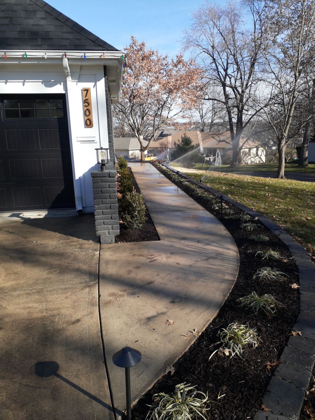 Entire Home Landscape and Retaining Walls by LAND ESCAPES LLC