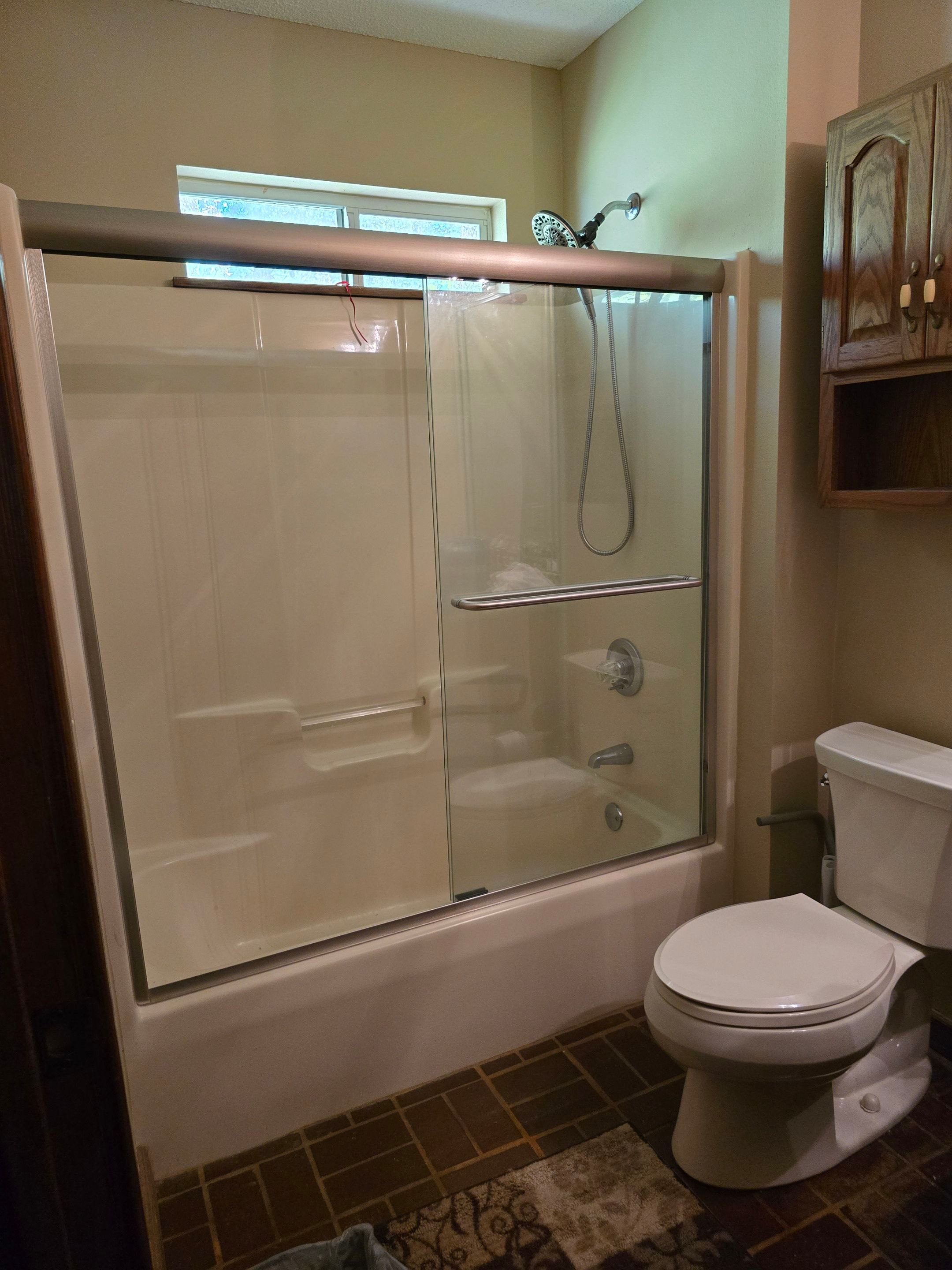 Sentrel Shower with window and ADA chair / ADA grab bar by Academy Construction