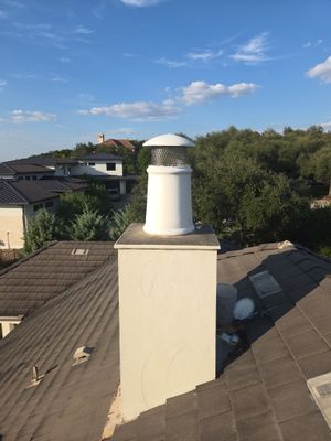 Tile roof and custom chimney cap
