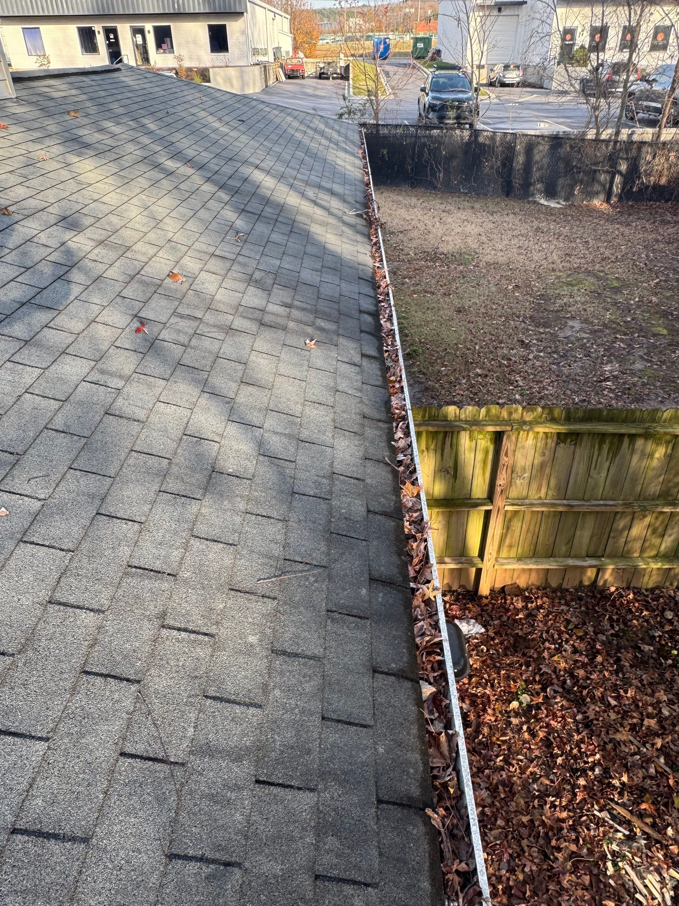 Commercial gutter cleaning Georgia before photo with filled gutters