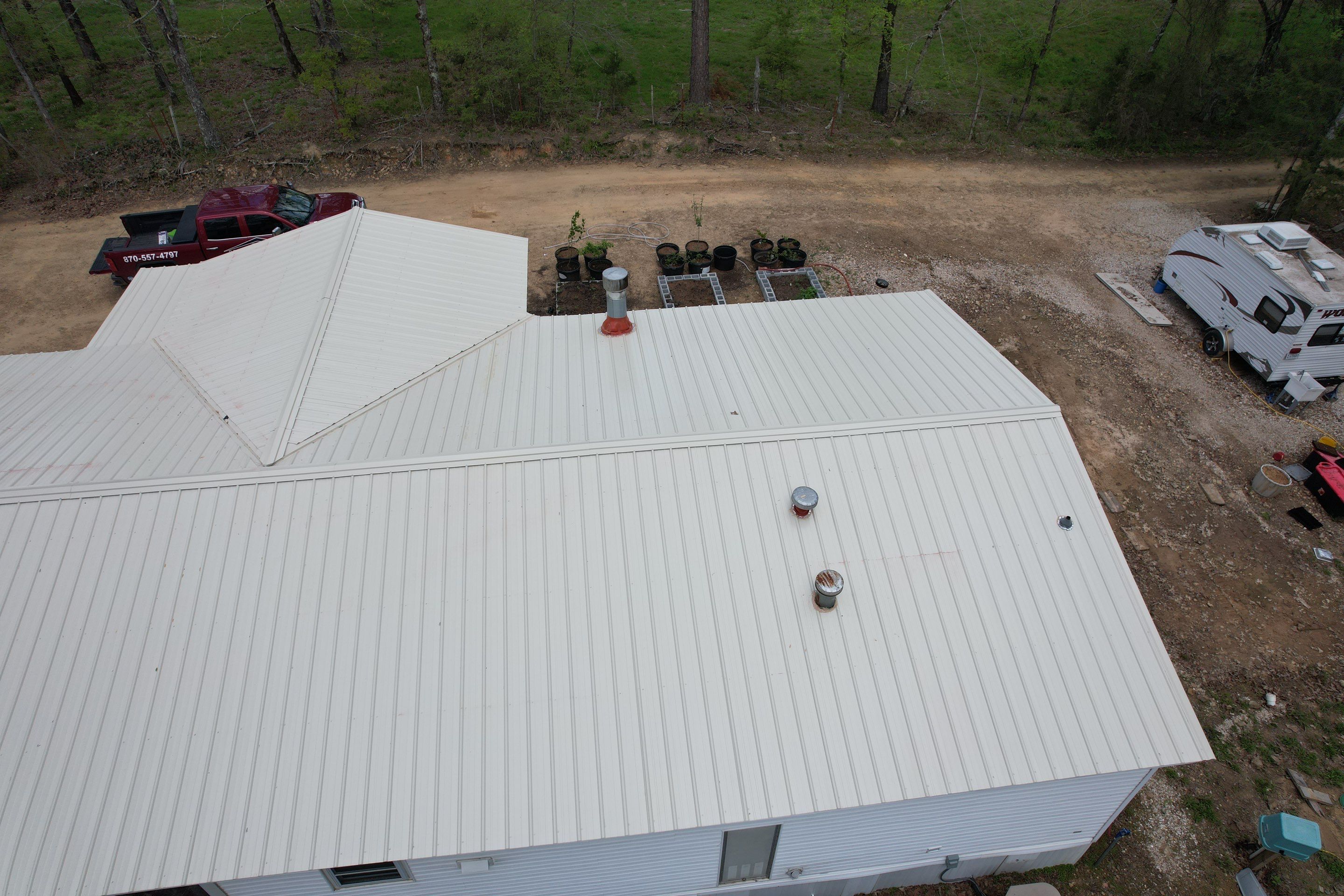 Residential Roofing Installation using 26 Gauge Colored Panels by Hostetler Roofing