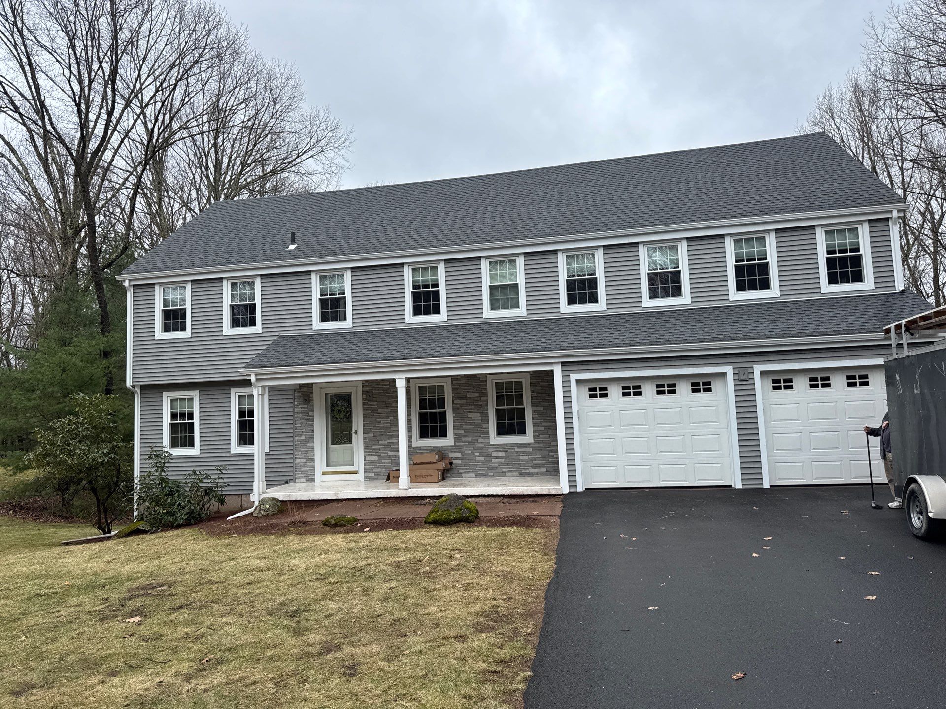 Glastonbury Exterior Renovation with Castle Stone Siding & Stone Entry Upgrade by Turner Home Improvement Contractors, LLC