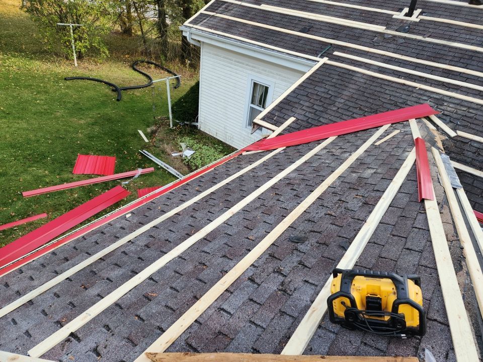 Residential Roof Installation with Red Pro Rib Metal Roofing in Adell, WI by Gellings Roofing & Siding