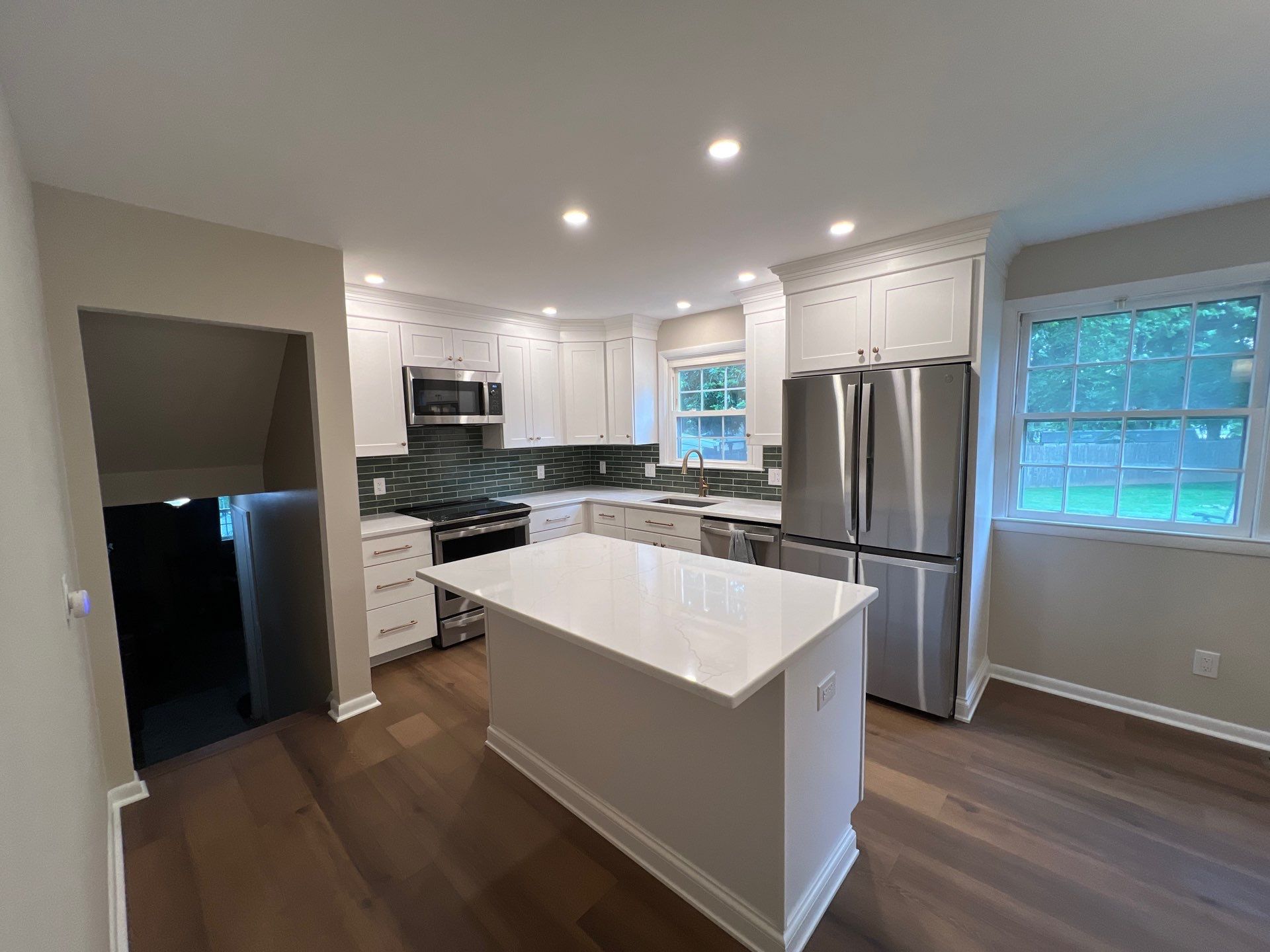 Phoenixville Kitchen Remodel with White Shaker Cabinets and Green Backsplash by Reliable General Contracting