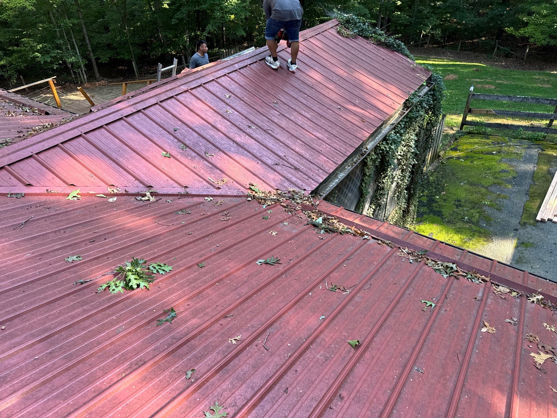 Red Metal Roof Restoration and Wood Fascia Replacement in Barboursville by Cade Construction