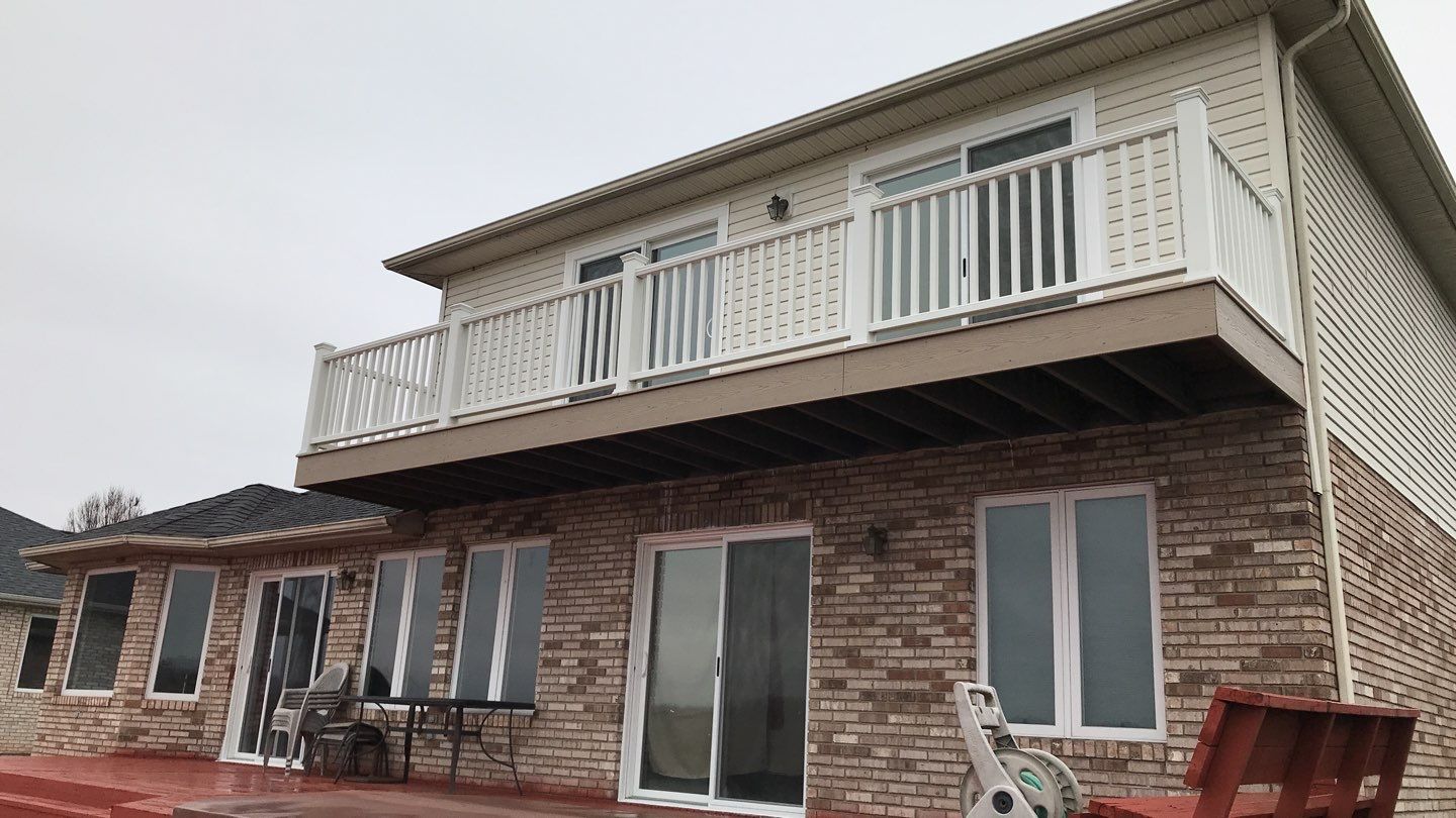 Deck Refurbush and Door Replacement using Trex Decking and Railing. Polaris Patio Doors by Secure Construction Company Inc