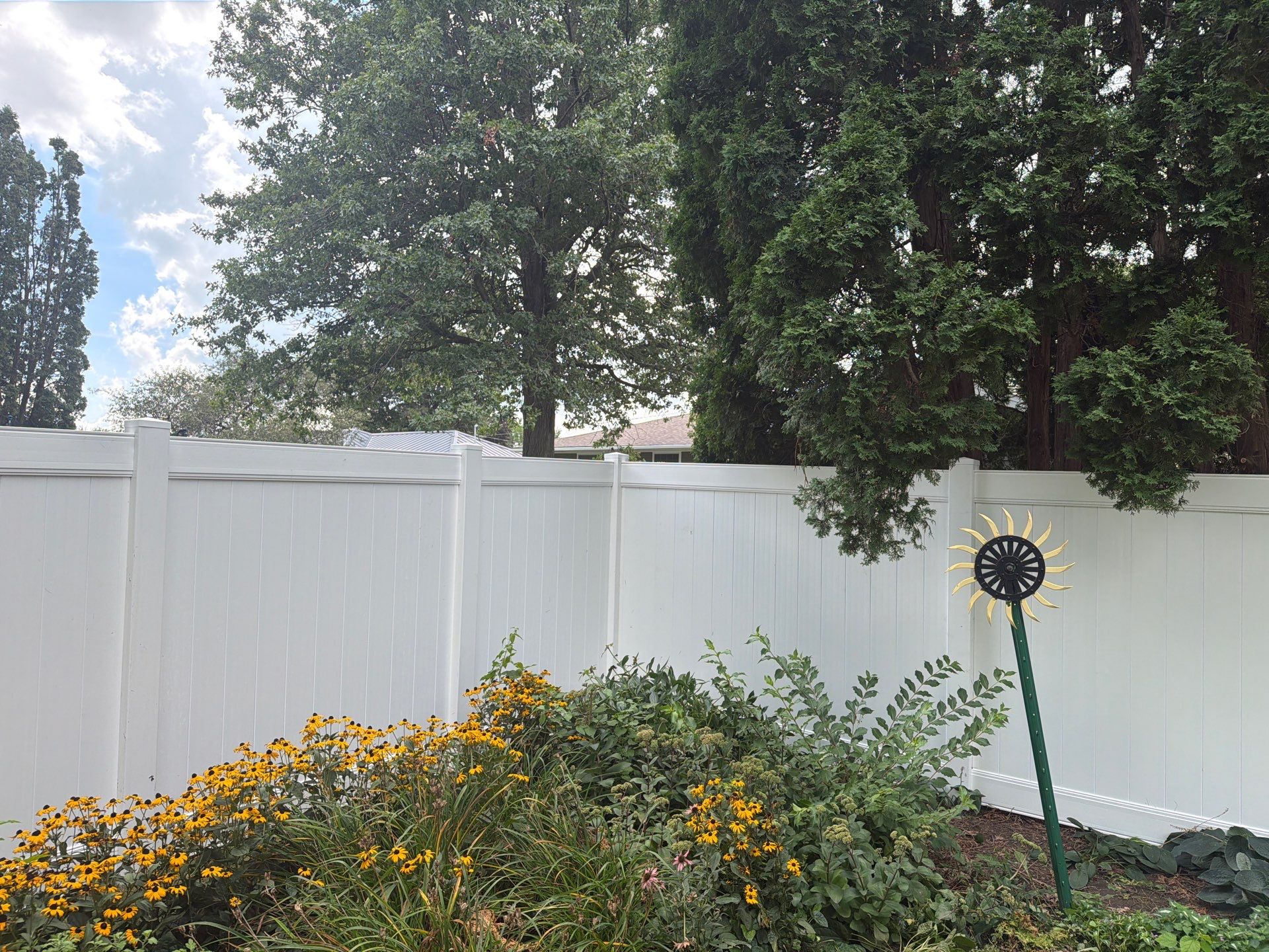 Residential White Vinyl Privacy and Black Chain Link Fencing in Jesup by Perfect Picket Fence and Stain