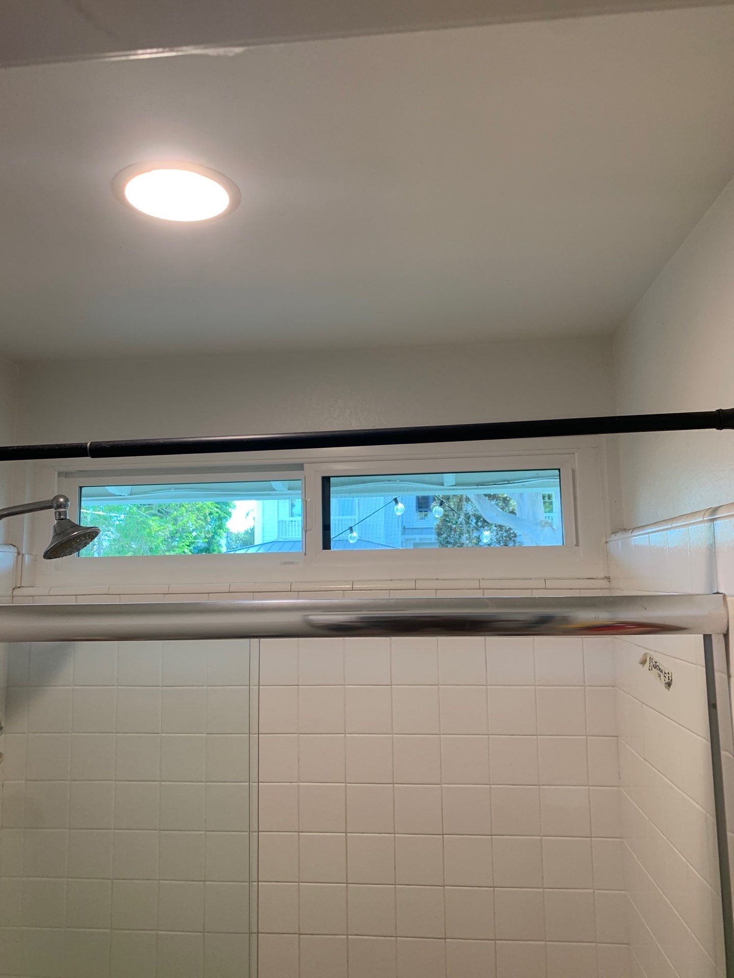 Window Installation using Milgard black vinyl windows by American Window Company