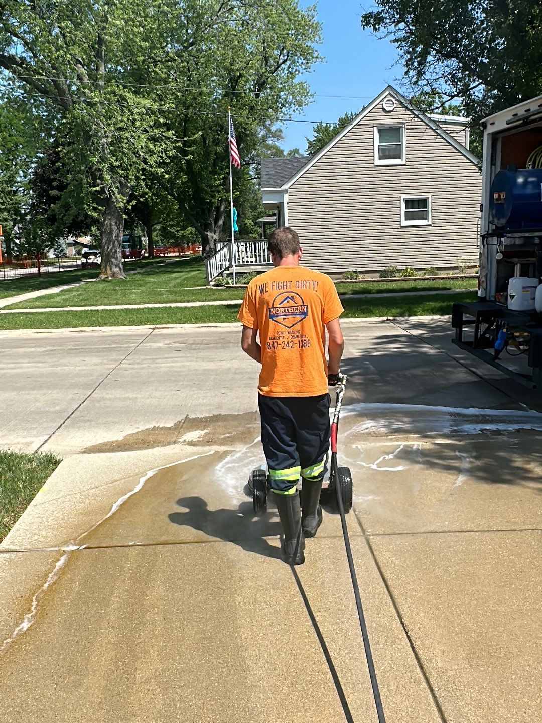 Oil extraction from concrete driveway.  by Northern Power Washing LLC.