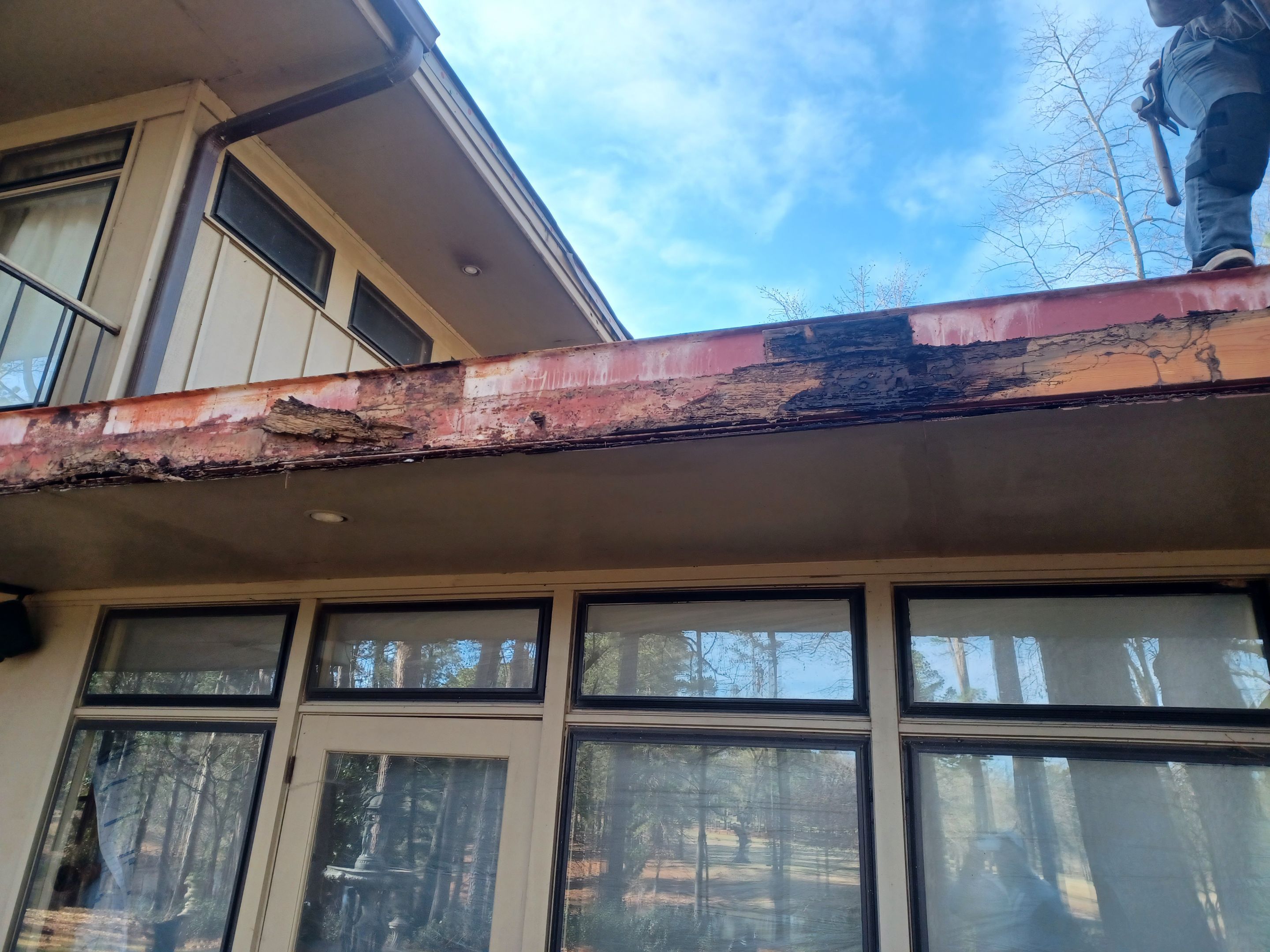 Residential Roofing Installation using PVC membrane and 24 gauge Standing Seam Metal by Hostetler Roofing