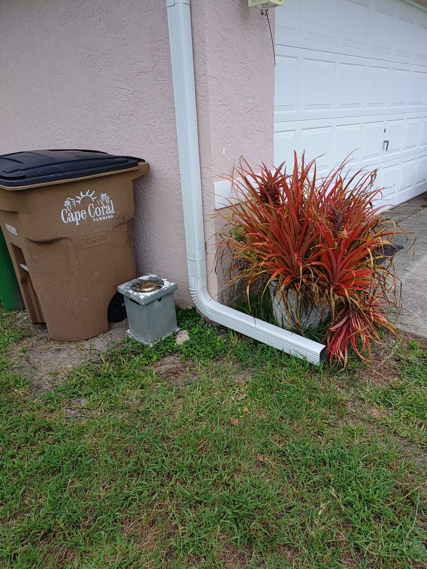 Replace gutter using White Down Spouts in Cape Coral FL by Gutter Professors