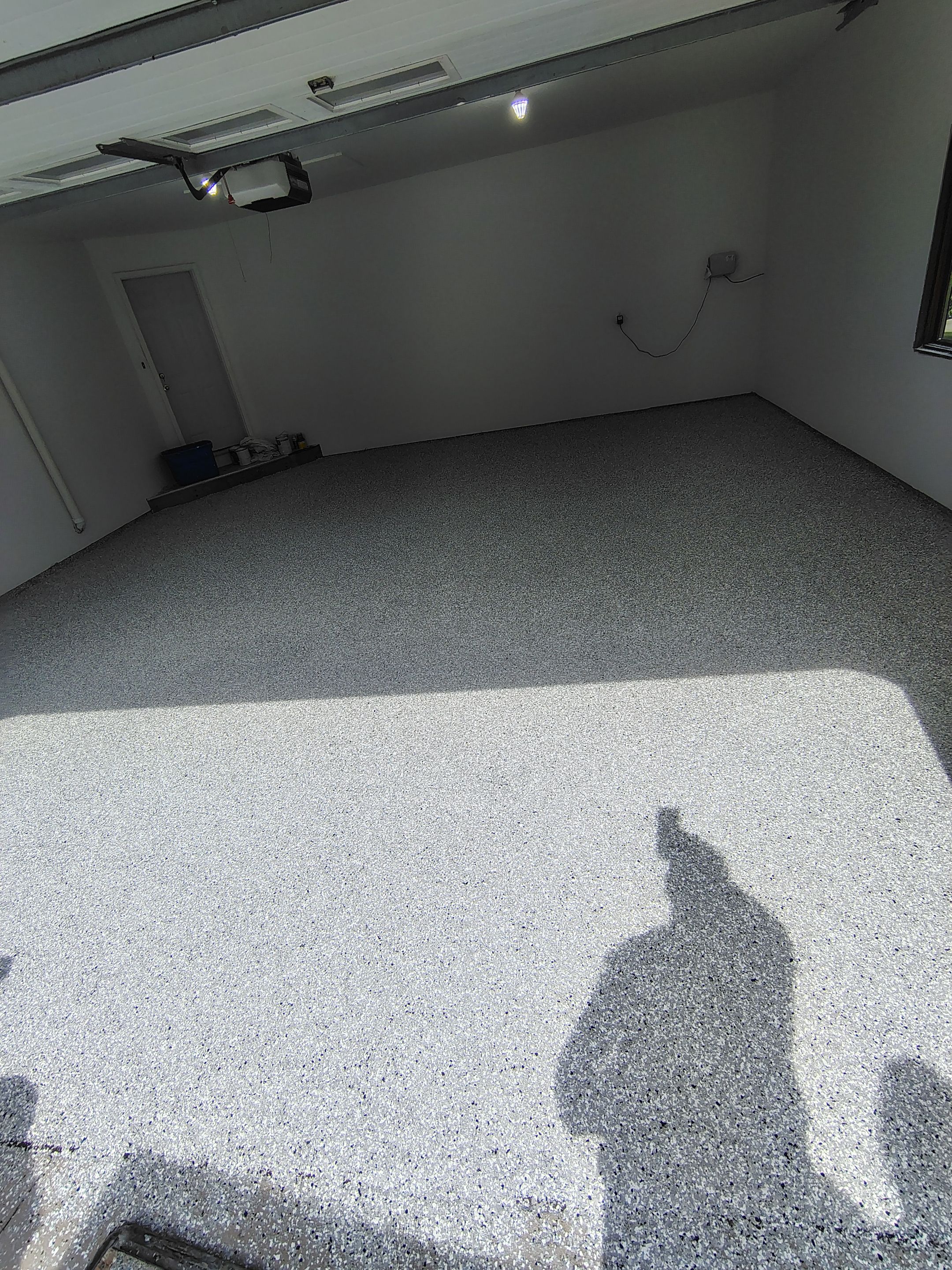 Sioux Falls Garage Floor Coating with Speckled Flake Finish by Select Painting, Coatings & Garage Cabinets