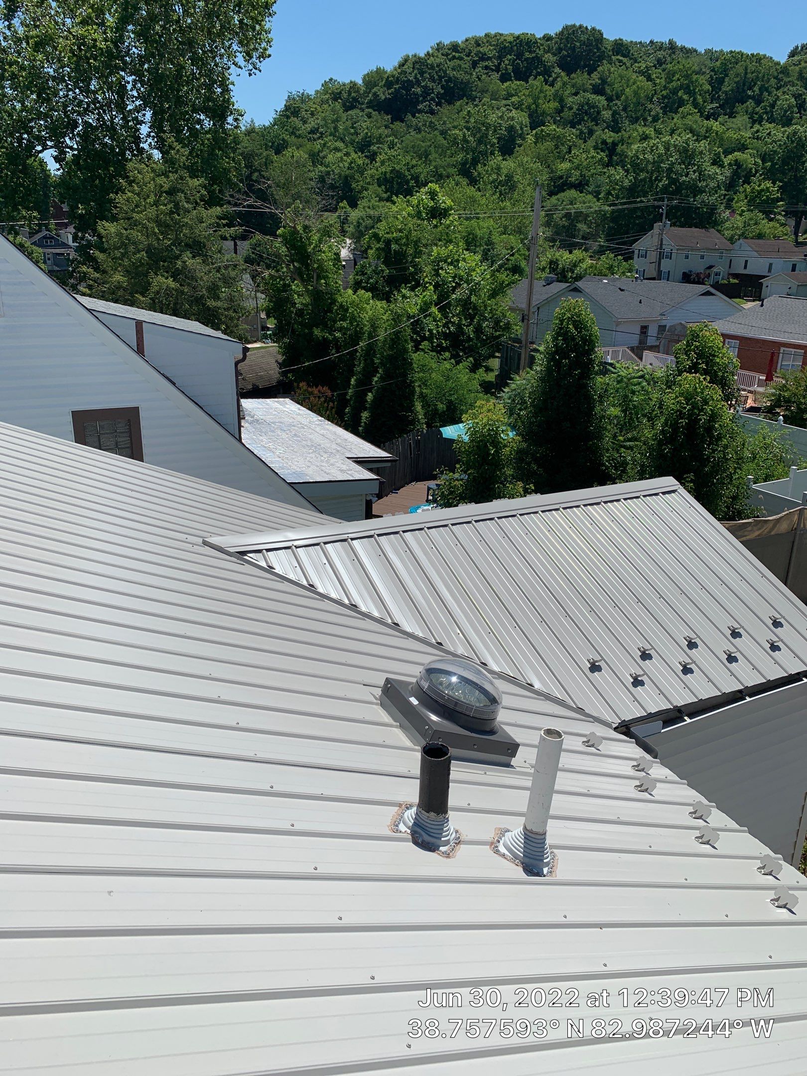 Metal Roofing, Skylights, Porch Build by Secure Construction Company Inc