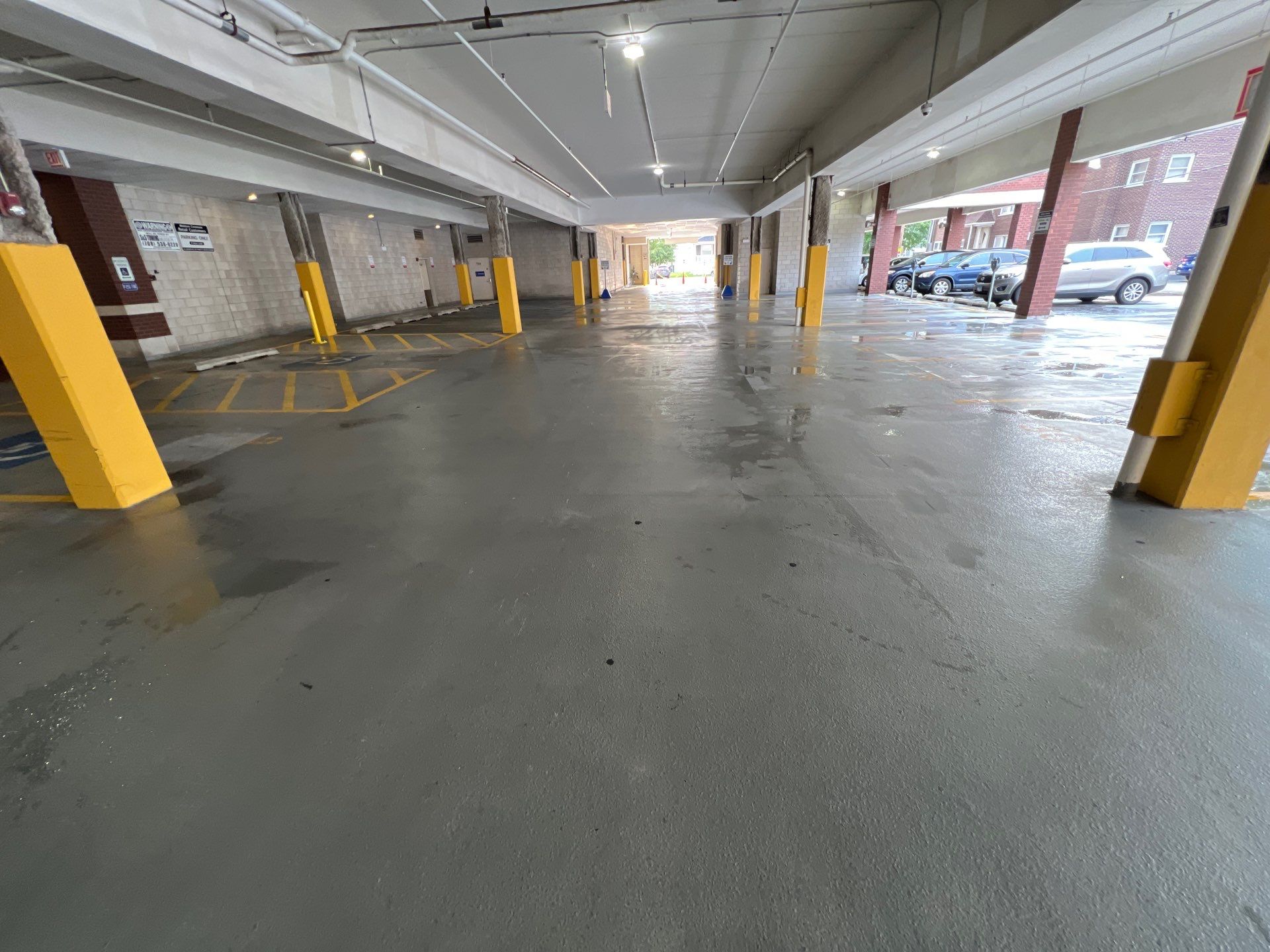 Parking garage using Hot water by Northern Power Washing LLC.