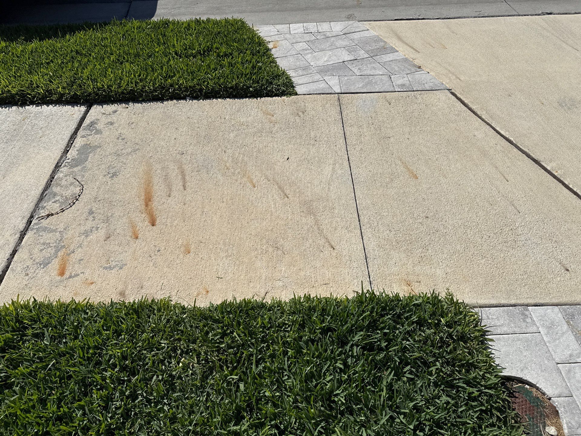 Rust Stain Removal from Concrete Driveway and Pavers in Park East at Azario | Lakewood Ranch, FL by Sunshine AquaWash