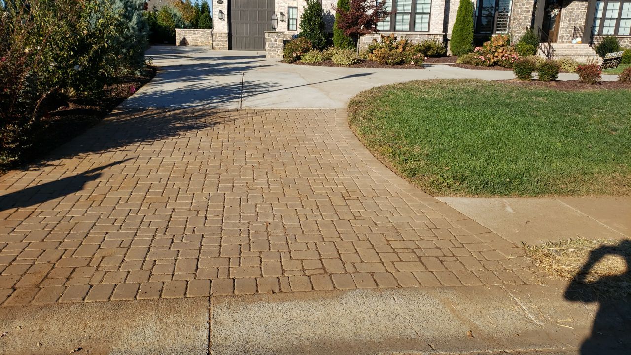 Driveway Clean using cleaner by Power Wash Masters LLC