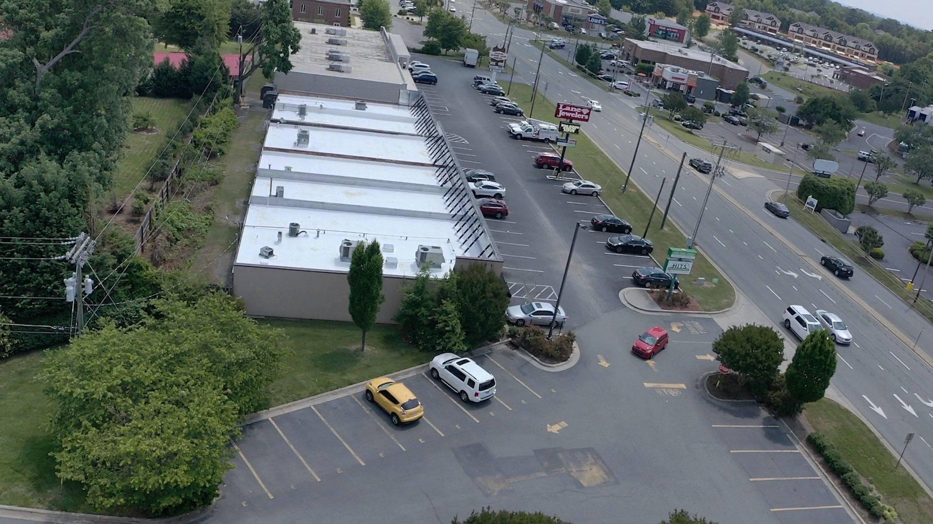 Commercial Roof Coating using Fiberseal basecoat and Silicon Topcoat by Just In Time Roofing and Restoration