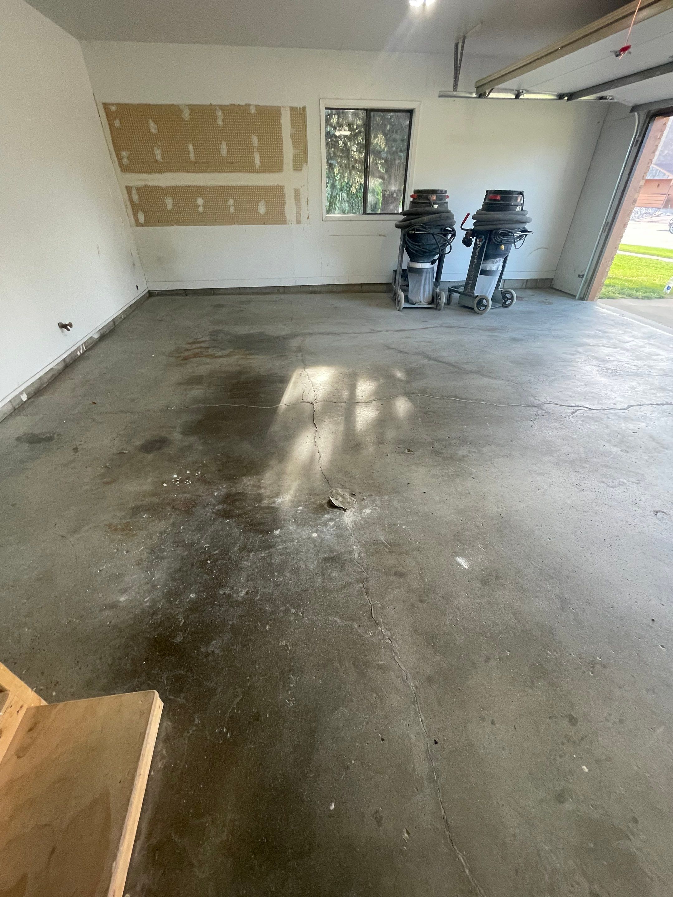 Grey Speckled Concrete Coating for Residential Garage in Yankton by Select Painting, Coatings & Garage Cabinets