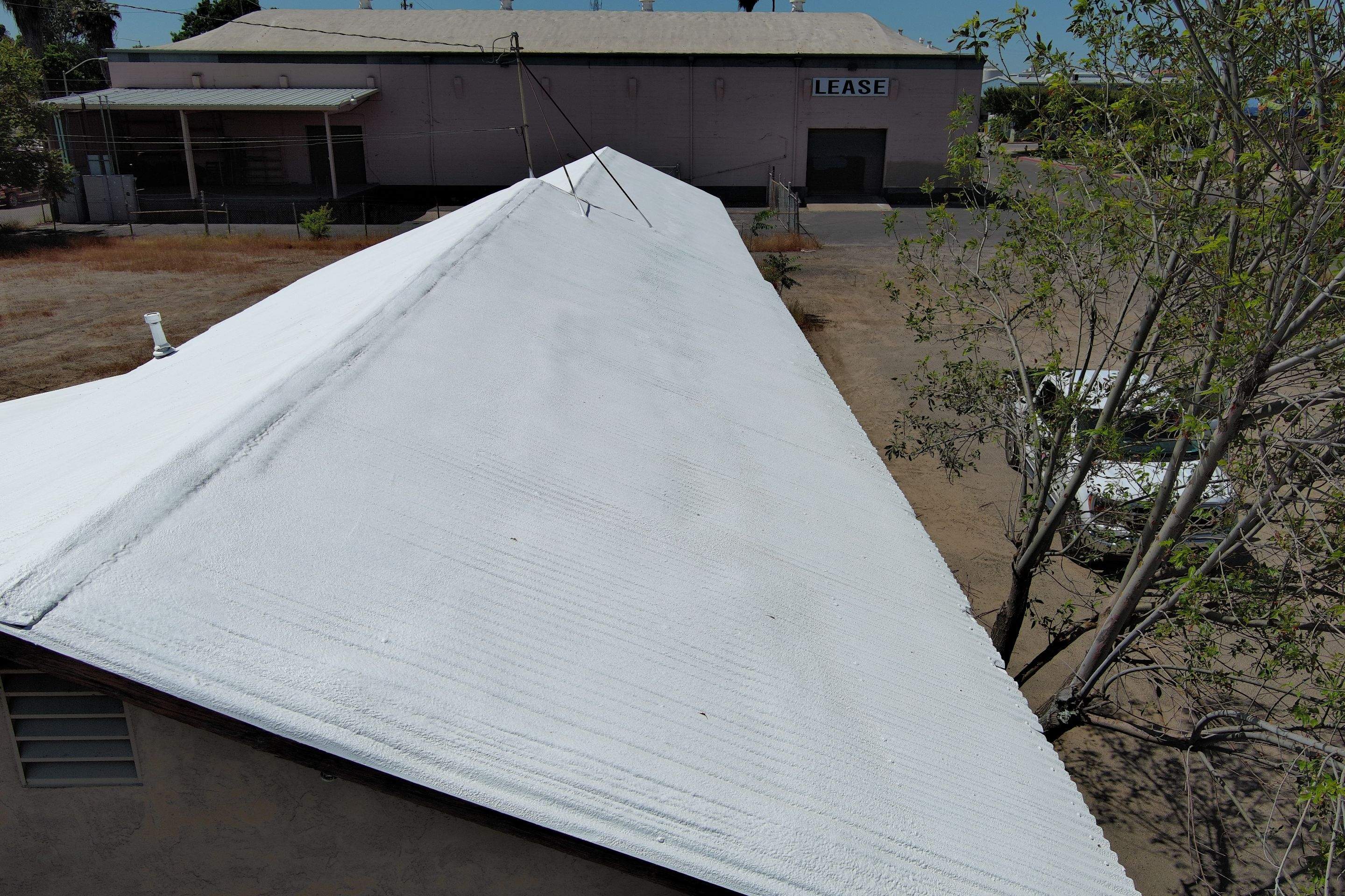 Spray foam and coatings using Conklin Benchmark/PUMA XL by Straight Edge Roofing Inc