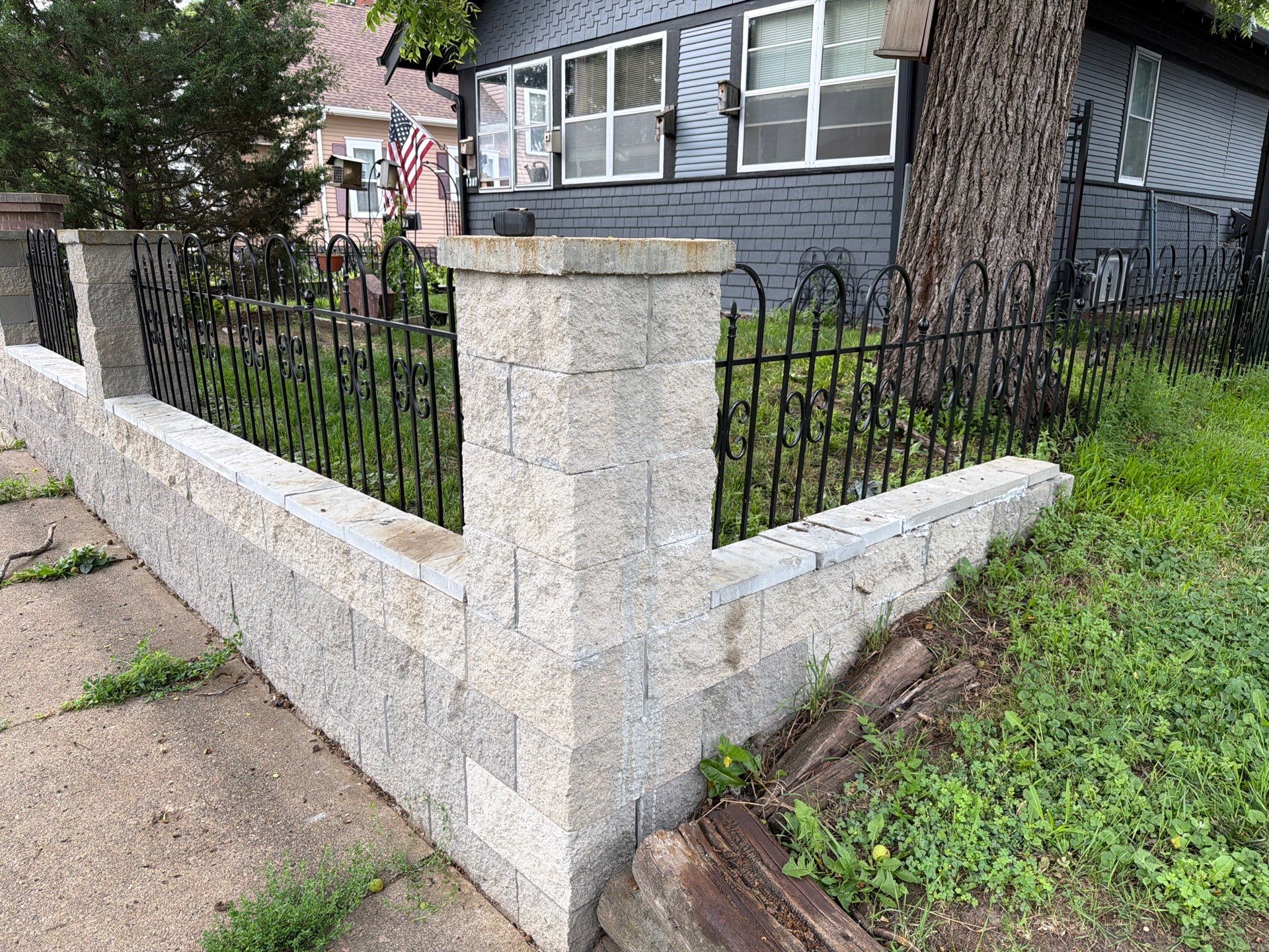 Exterior Masonry Painting for a Sioux Falls Retaining Wall by Select Painting, Coatings & Garage Cabinets