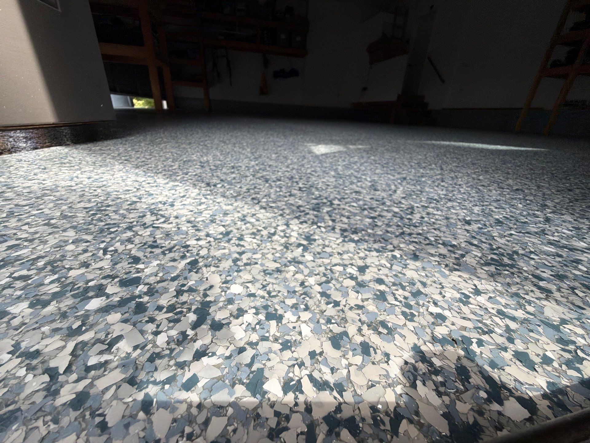 Custom Tidal Wave Epoxy Flake Floor Installation in Norton Shores. by Gordon Painting
