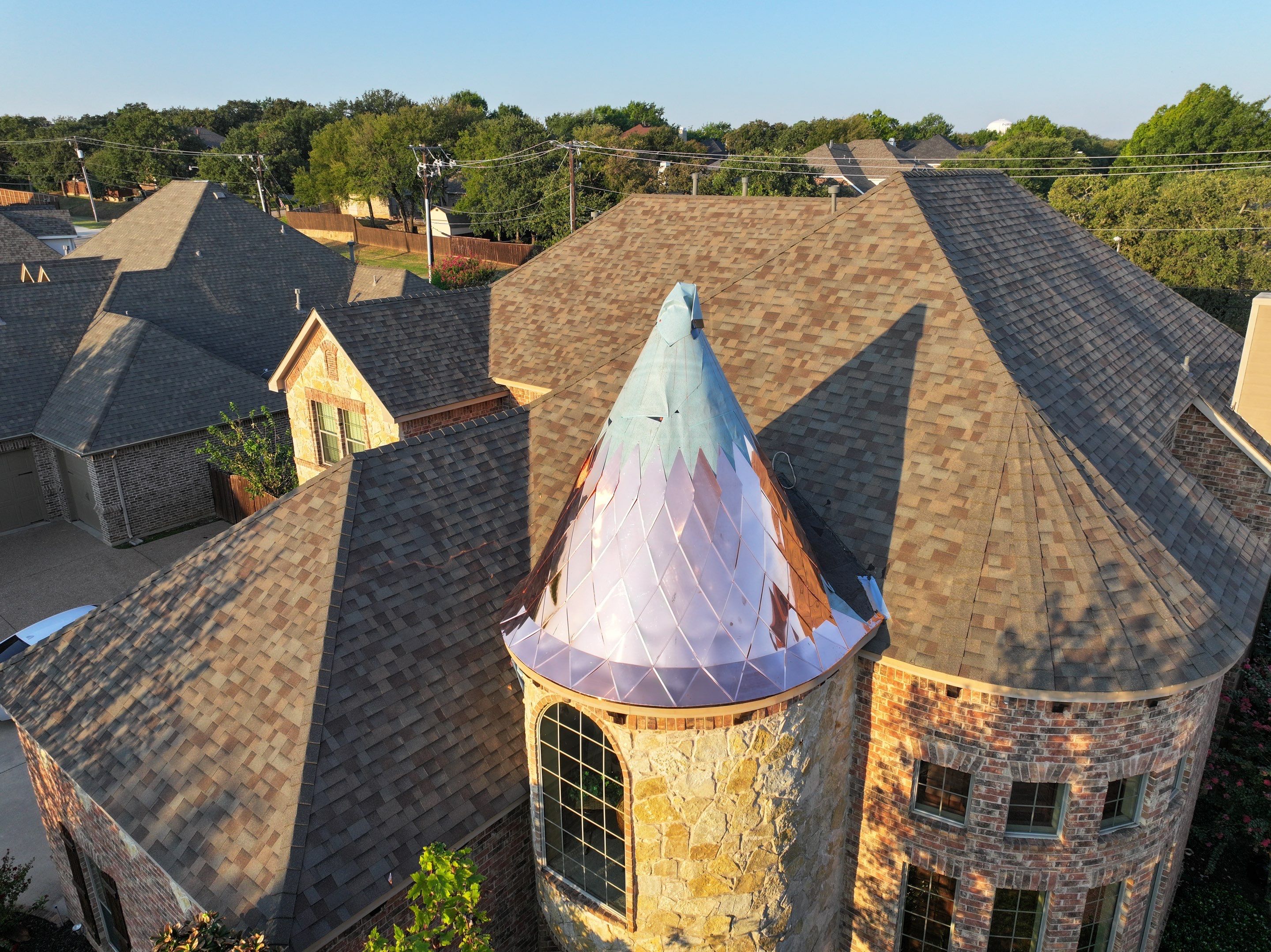 Installing Custom copper turret and Malarkey Vista Class 4 shingles Hail Damage Upgrade by Becker Roofing and Exteriors