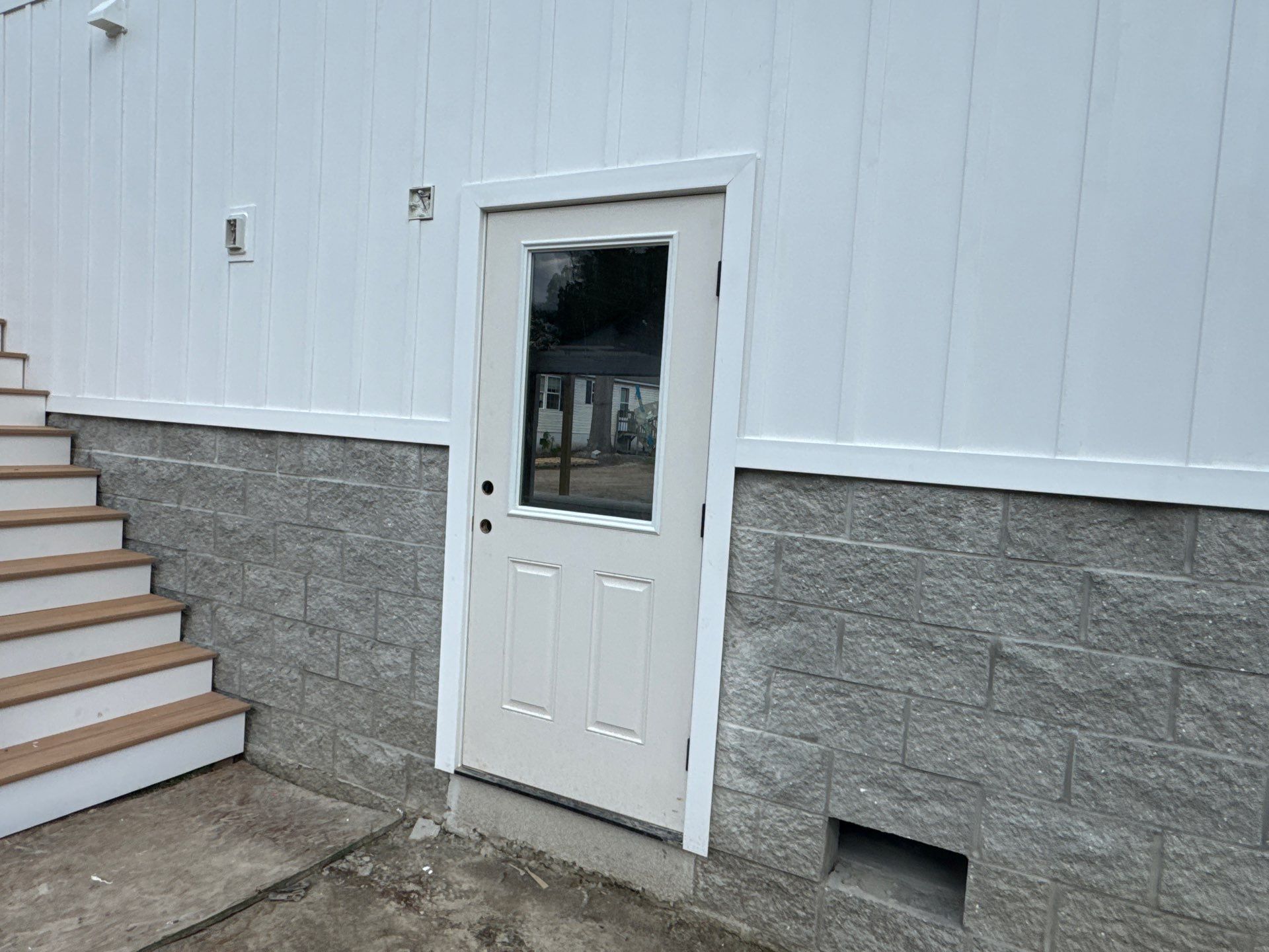 Two-Story Custom Home With Board and Batten Siding by Cade Construction