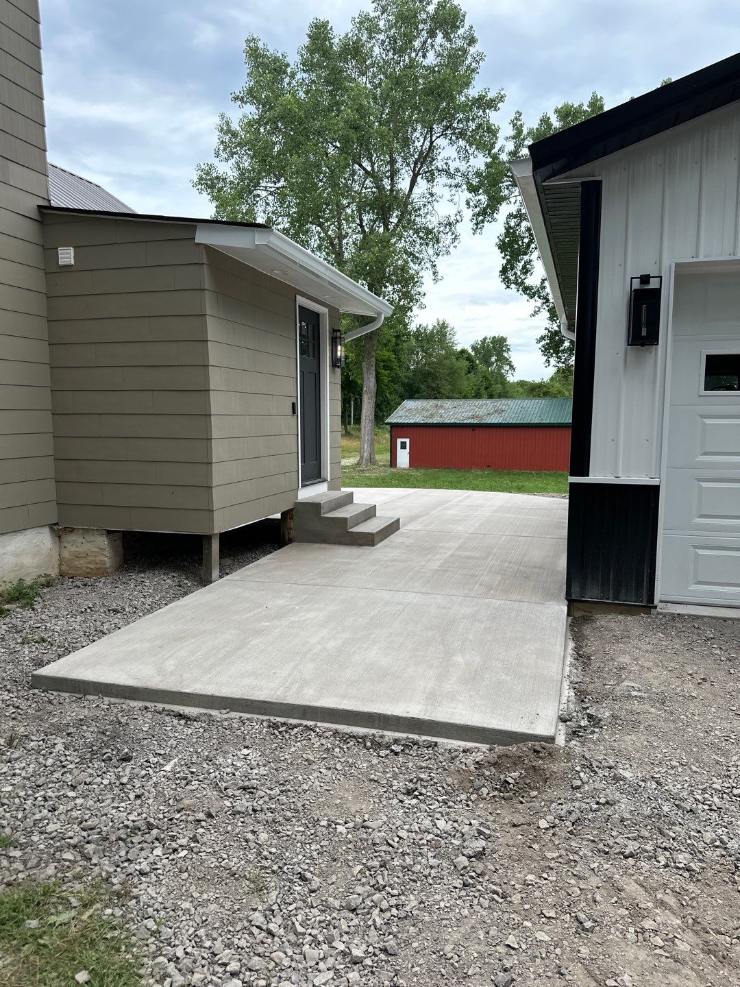 Broom finished concrete patio and sidewalk  by NG Masonry & Construction LLC