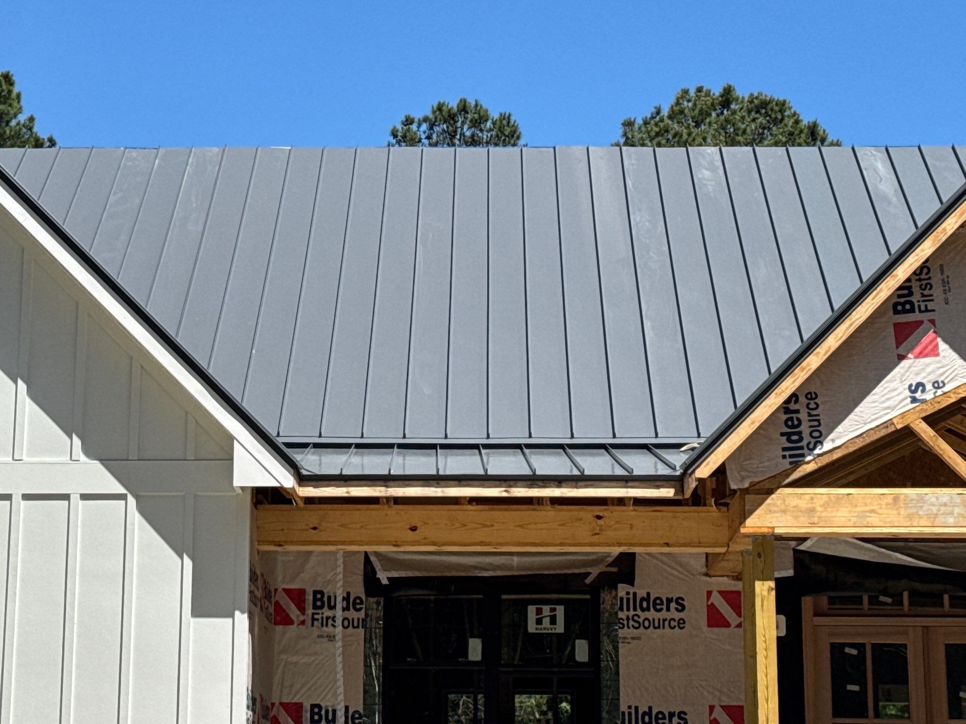 Custom New Construction Home Featuring Standing Seam Metal Roofing in Port Haywood by Cade Construction