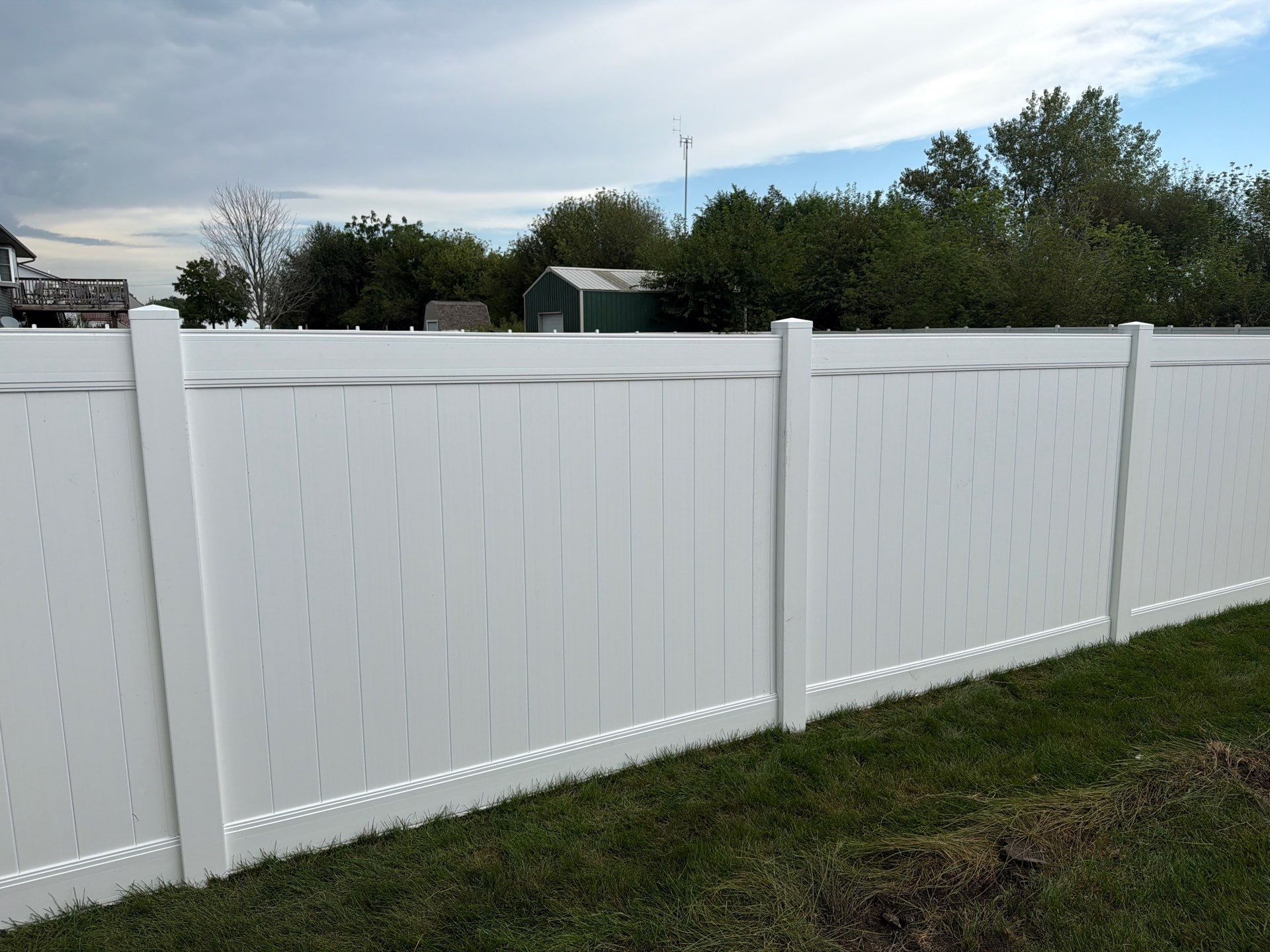 White Vinyl Privacy Fence Installation in Raymond, IA by Perfect Picket Fence and Stain