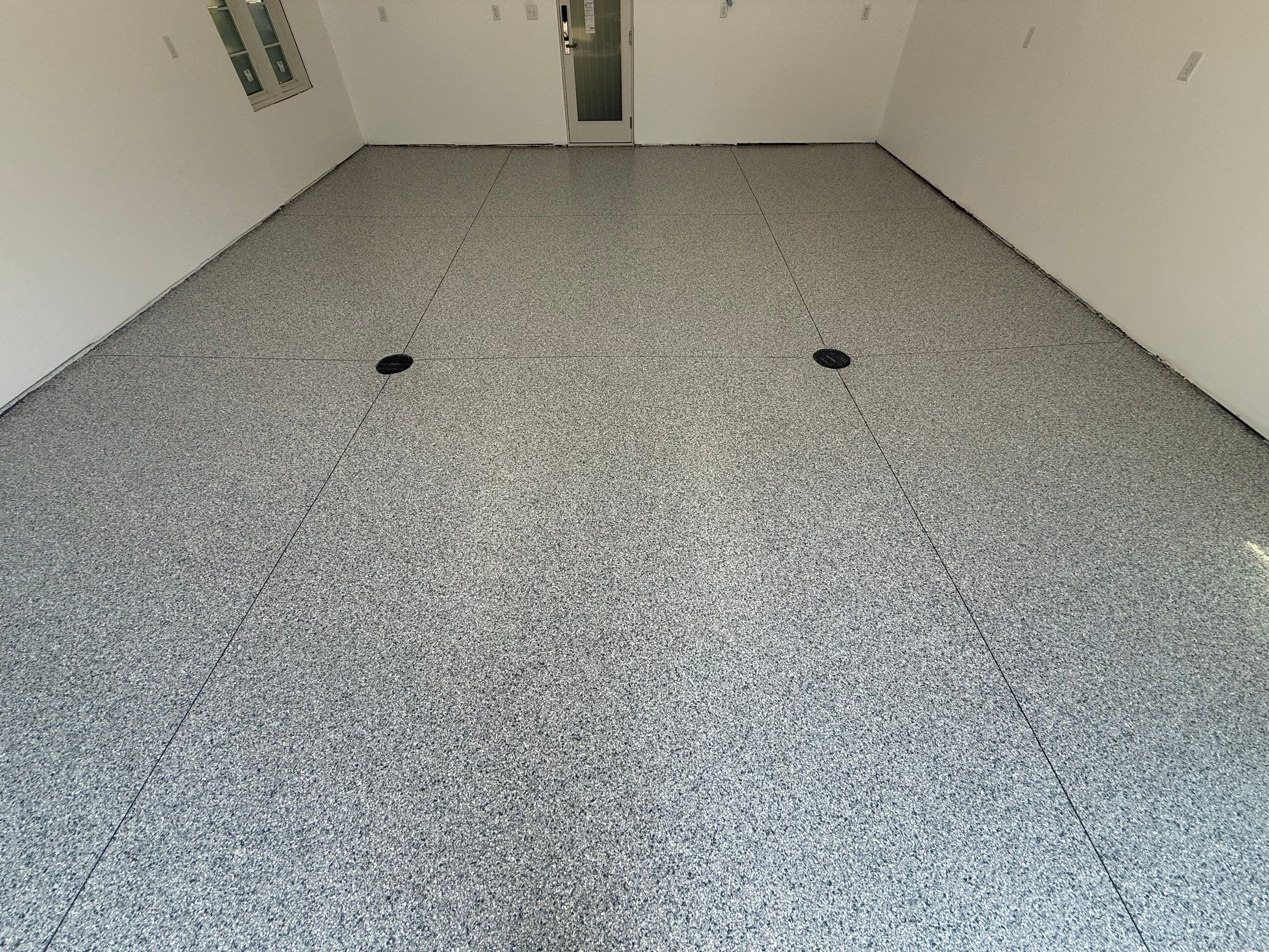 Multi-Car Garage Floor Coating Installation in Sioux Falls by Select Painting, Coatings & Garage Cabinets