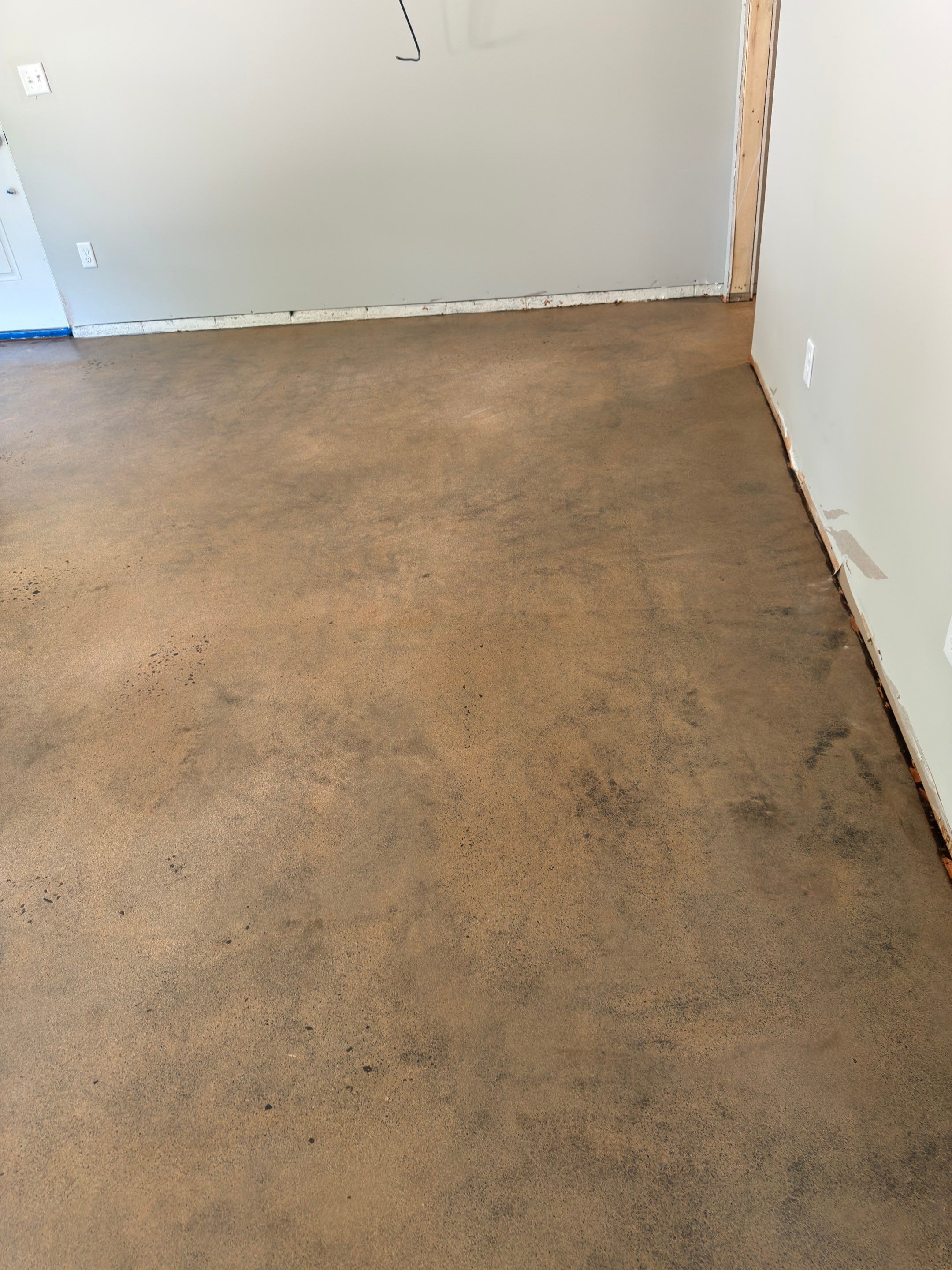 Stained Concrete using Antique Cork by Elite Floor Solutions
