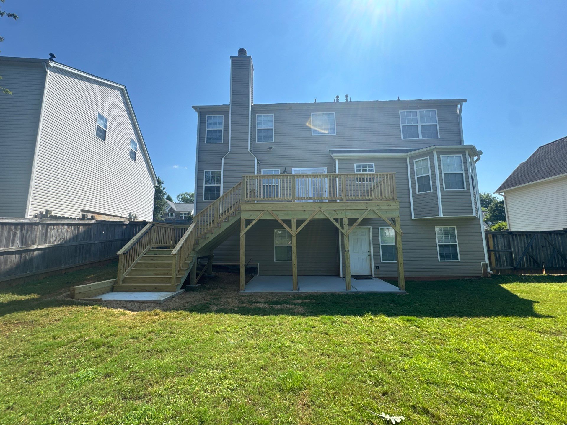 Backyard Deck Expansion & Custom Staircase Installation in Suwanee. by Swift Home Renovations