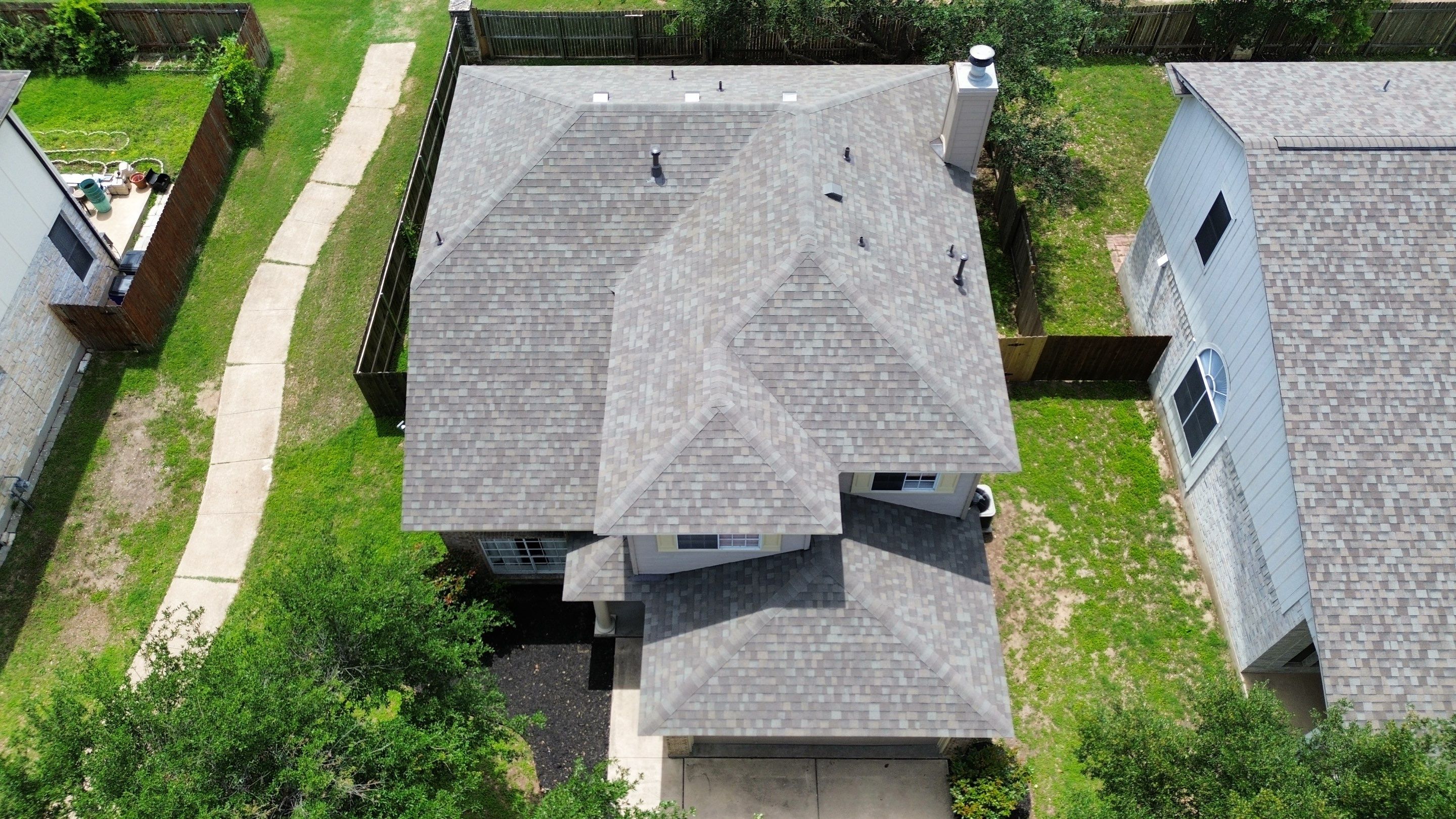 Roof Replacement & Chimney Cricket Upgrade in Cedar Park, TX by Kstylez Roofing & Construction