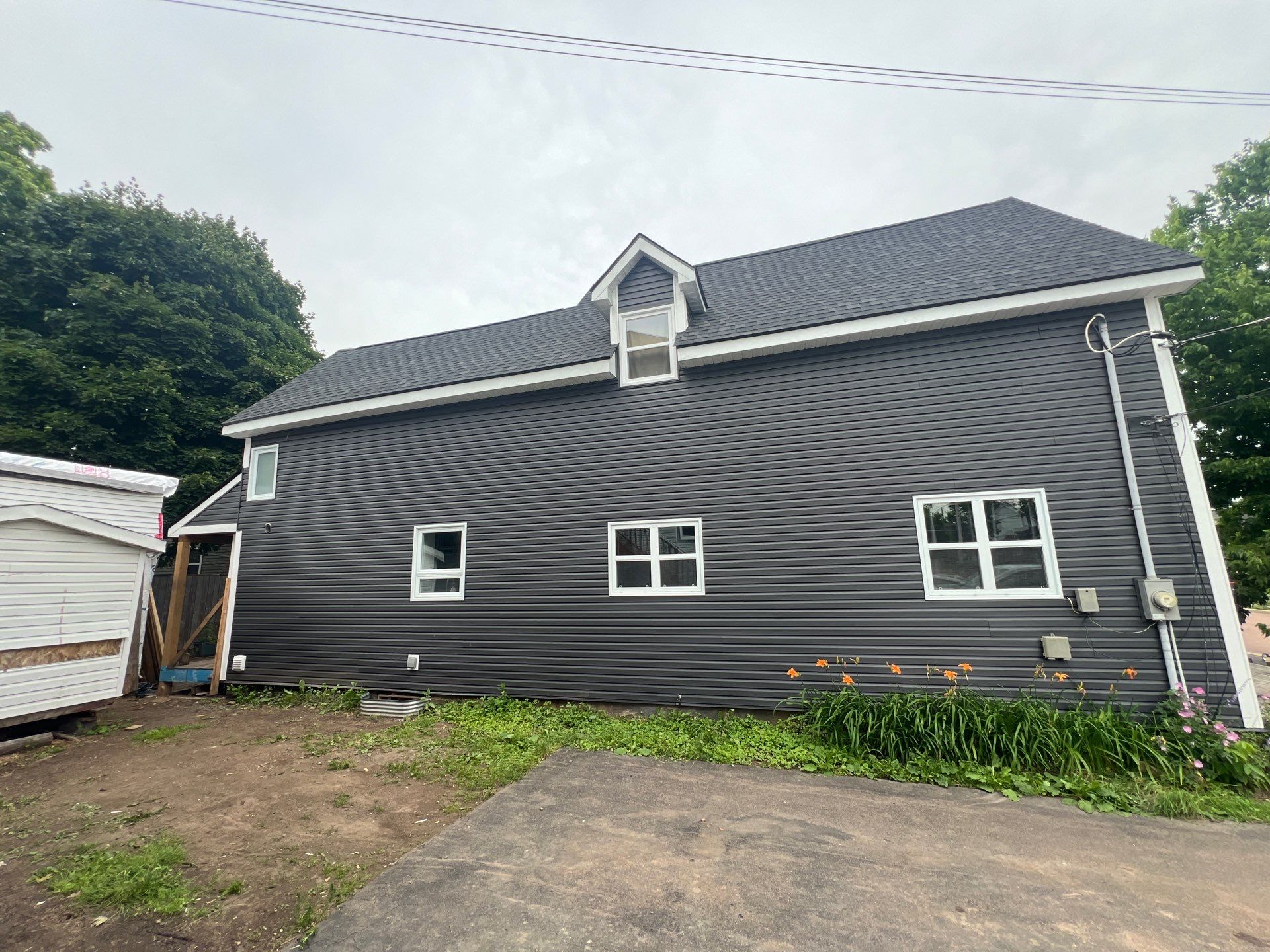 Exterior Renovation using New Roofing and Siding by Bobby Built