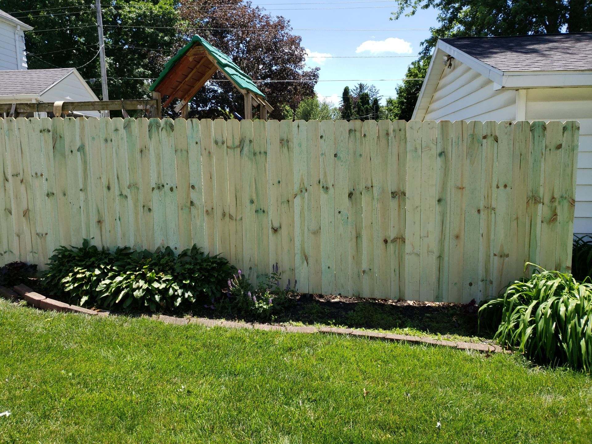 Pressure-Treated Pine Privacy Fence Replacement in Waterloo, Iowa by Perfect Picket Fence and Stain