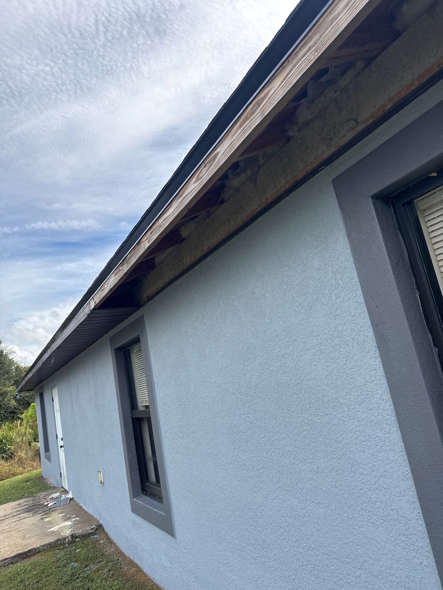 Black Seamless Gutters & Soffit/Fascia in Lehigh Acres FL by Gutter Professors