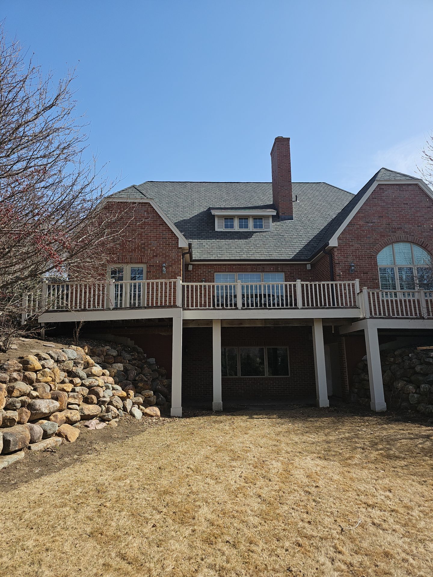 Residential Exterior Brick Painting and Limewash Refresh in Sioux Falls by Select Painting, Coatings & Garage Cabinets