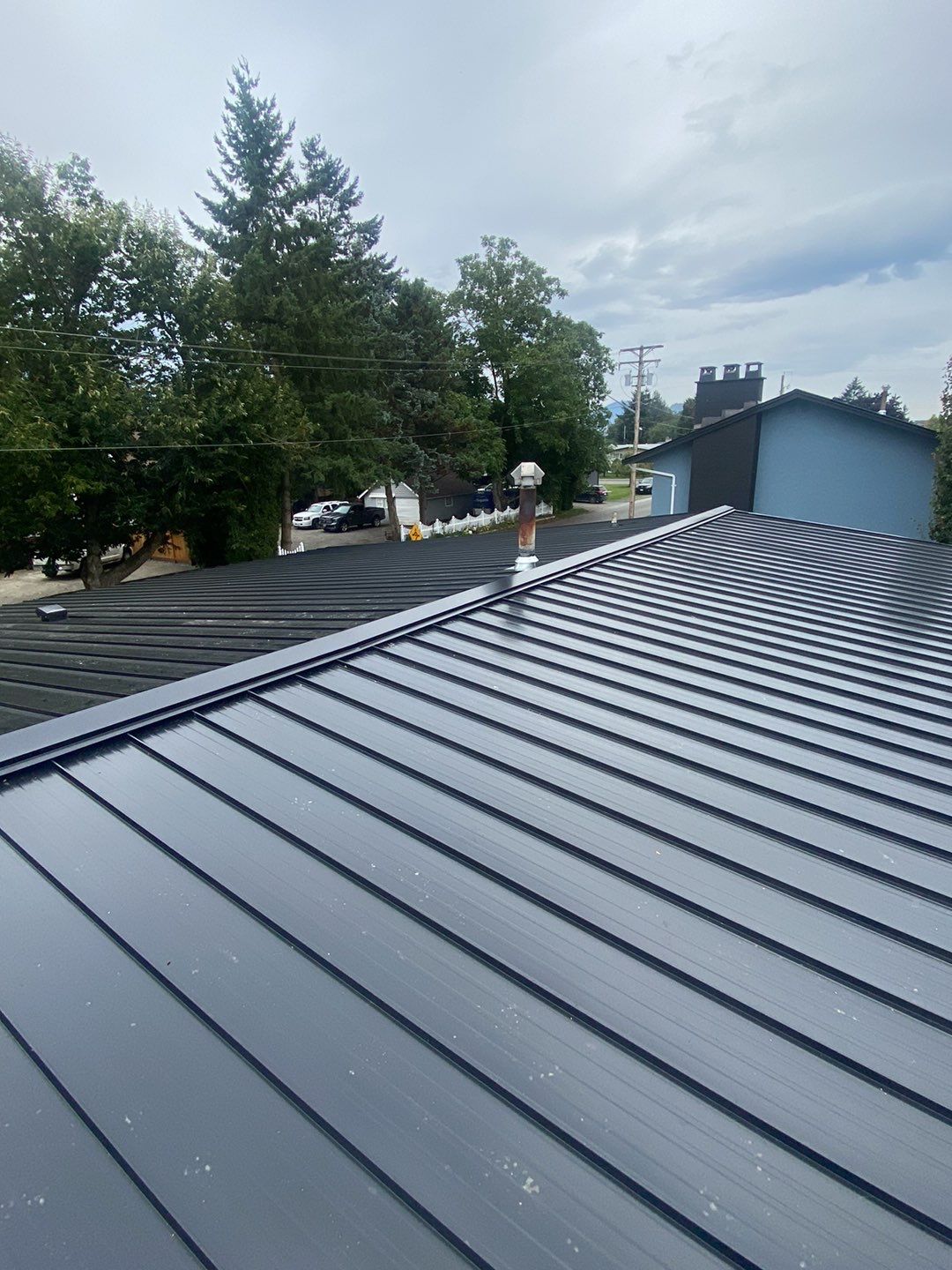 Residential Roofing Installation using 12" Prolok metal  by Top Notch Roofing Inc