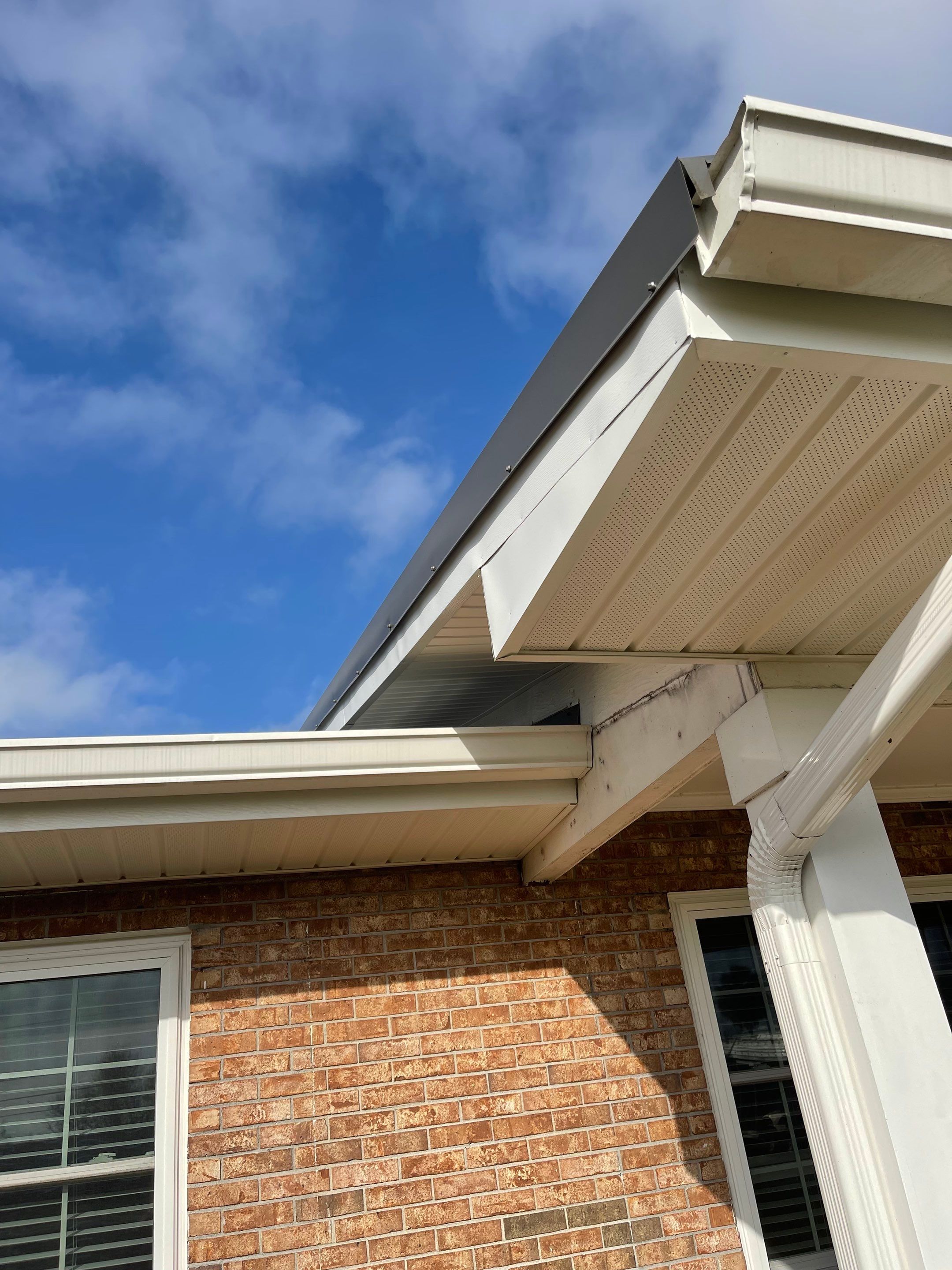 Soffit and Fascia Installation Using White Vinyl Soffit by Gutter Professors