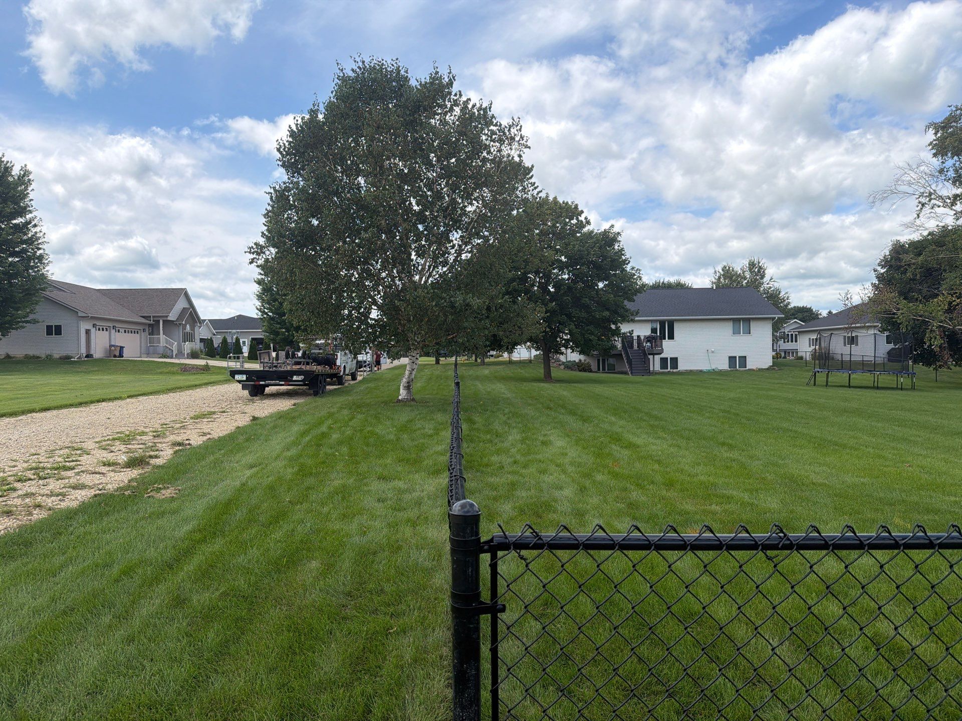 Black Vinyl-Coated Chain Link Fence Installation in Fairbank by Perfect Picket Fence and Stain