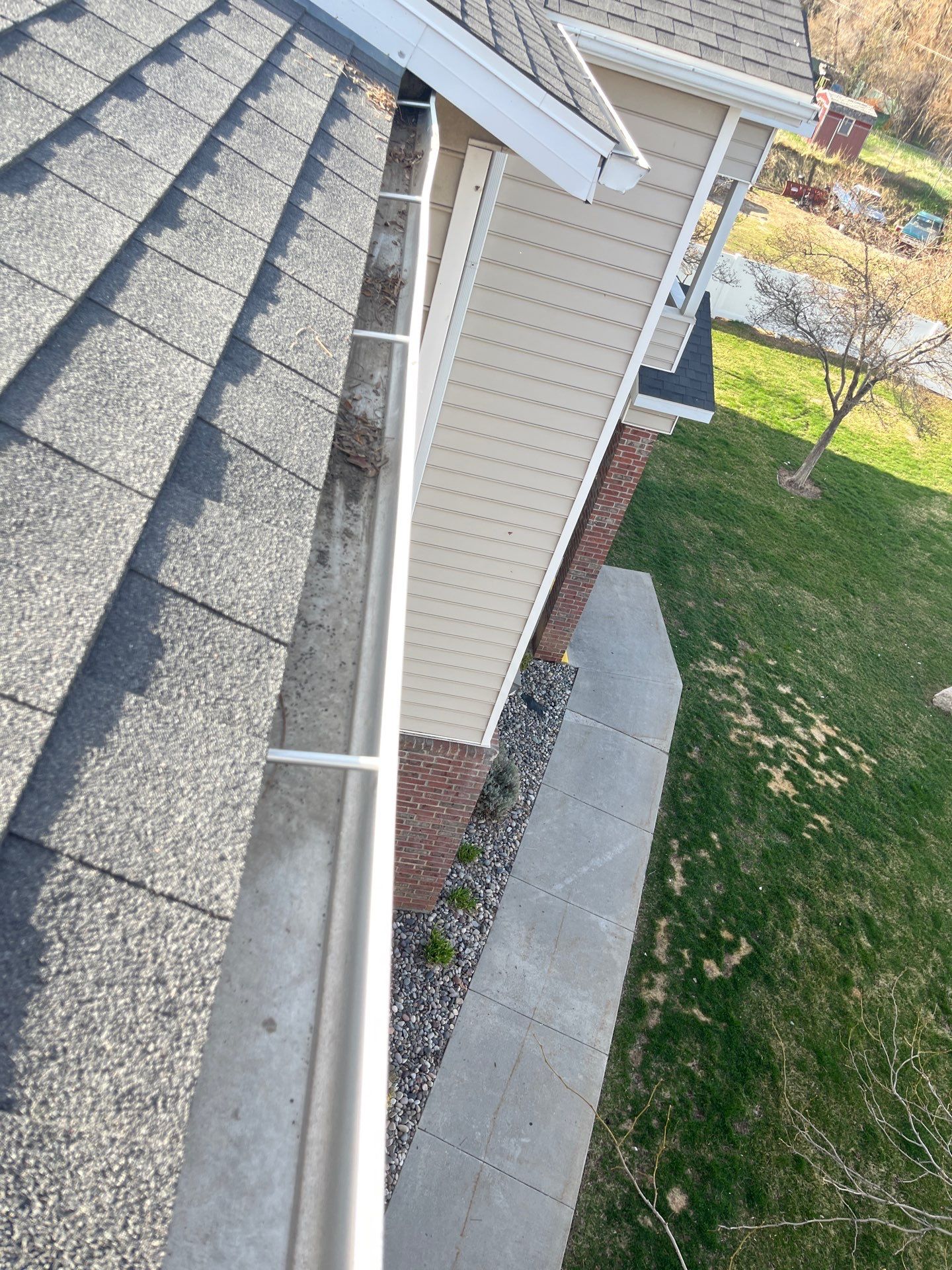 HOA gutter cleaning in Logan, UT after photo showing full gutters.