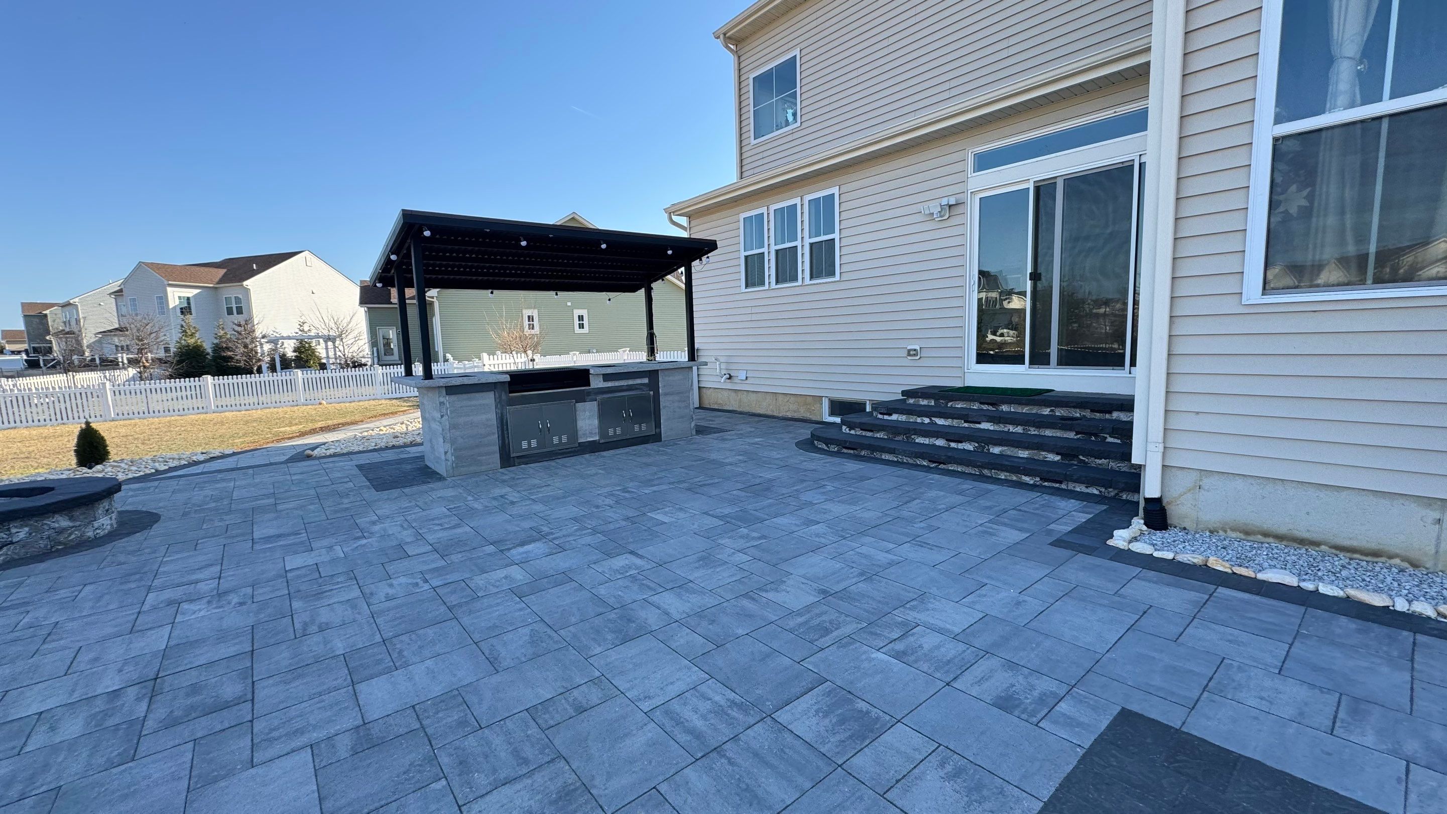 Custom Belgard patio by Studio G Indoor Spaces & Outdoor Living