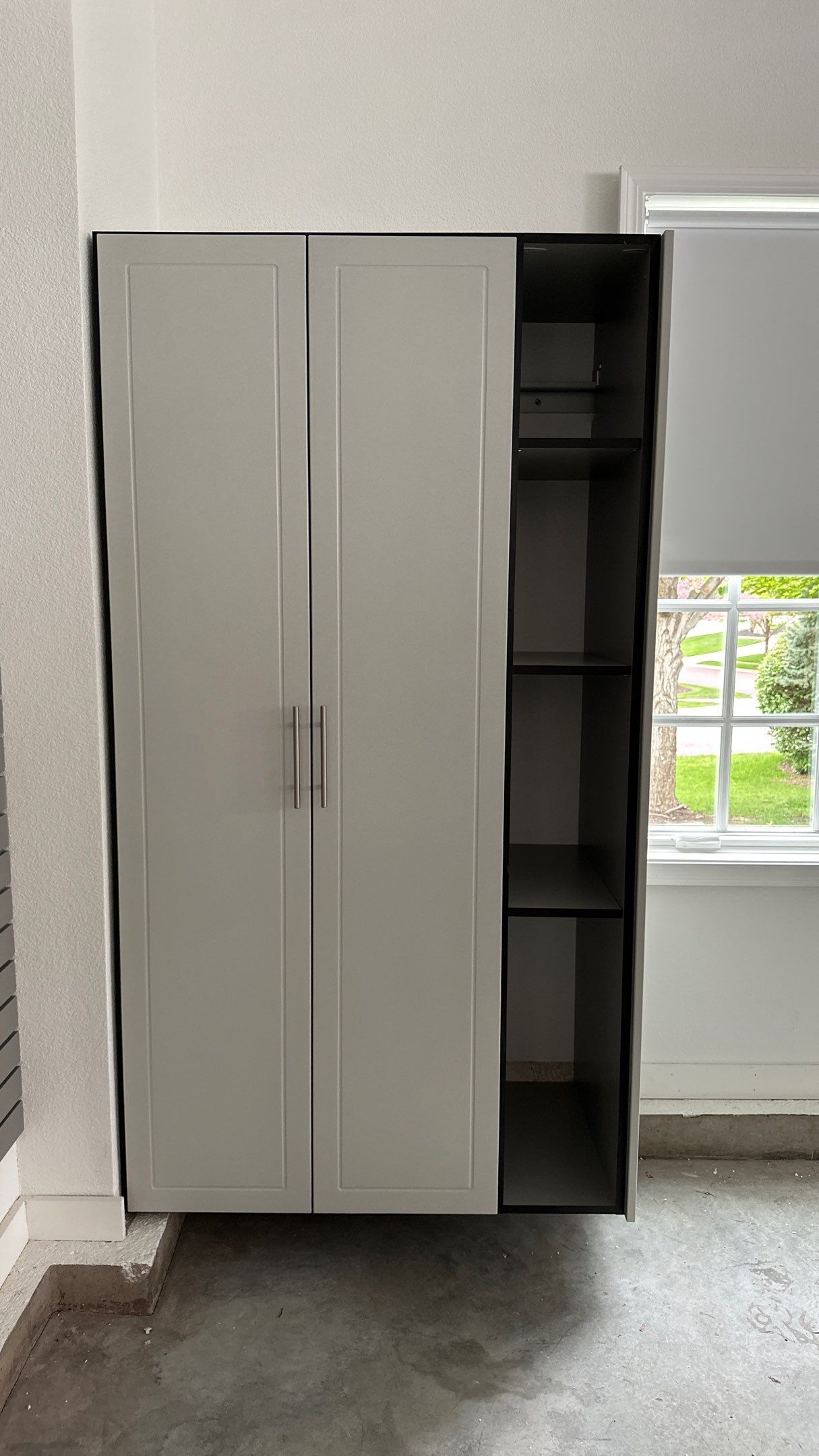 Brooke L. added cabinets for a clean storage look by Banner Garage