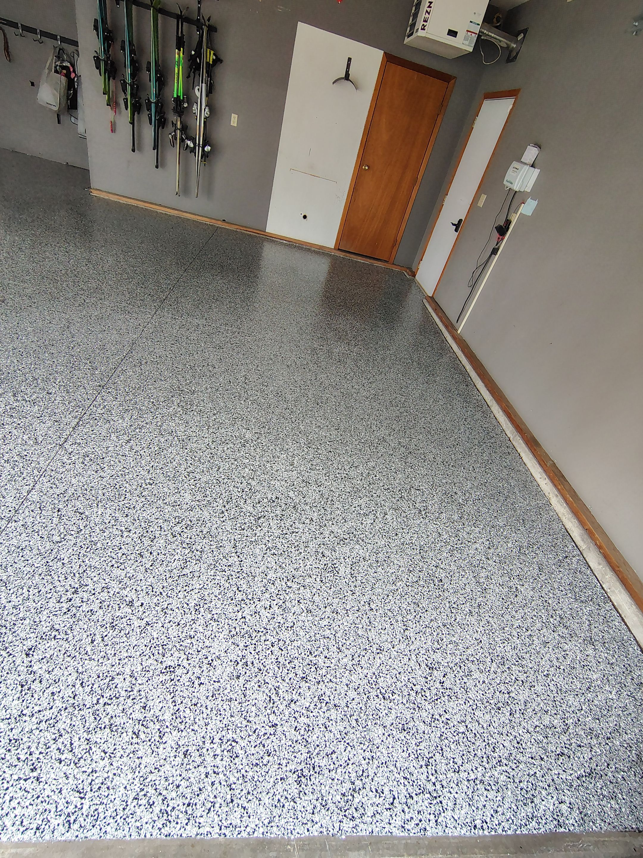 Garage Floor Concrete Coating and Crack Repair in Sioux Falls by Select Painting, Coatings & Garage Cabinets