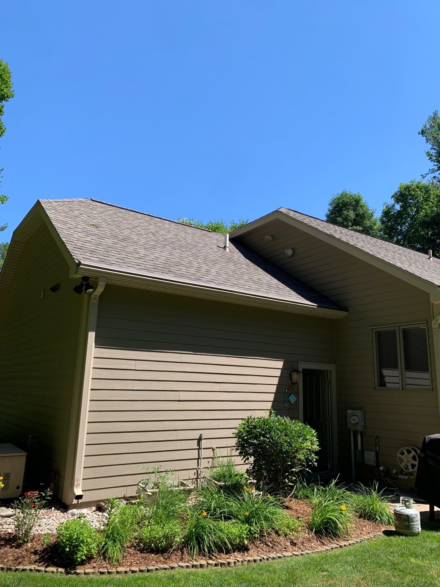 Gutter Helmet Installation on a Multi-Level Traverse City Residence by Rainbow Seamless Systems